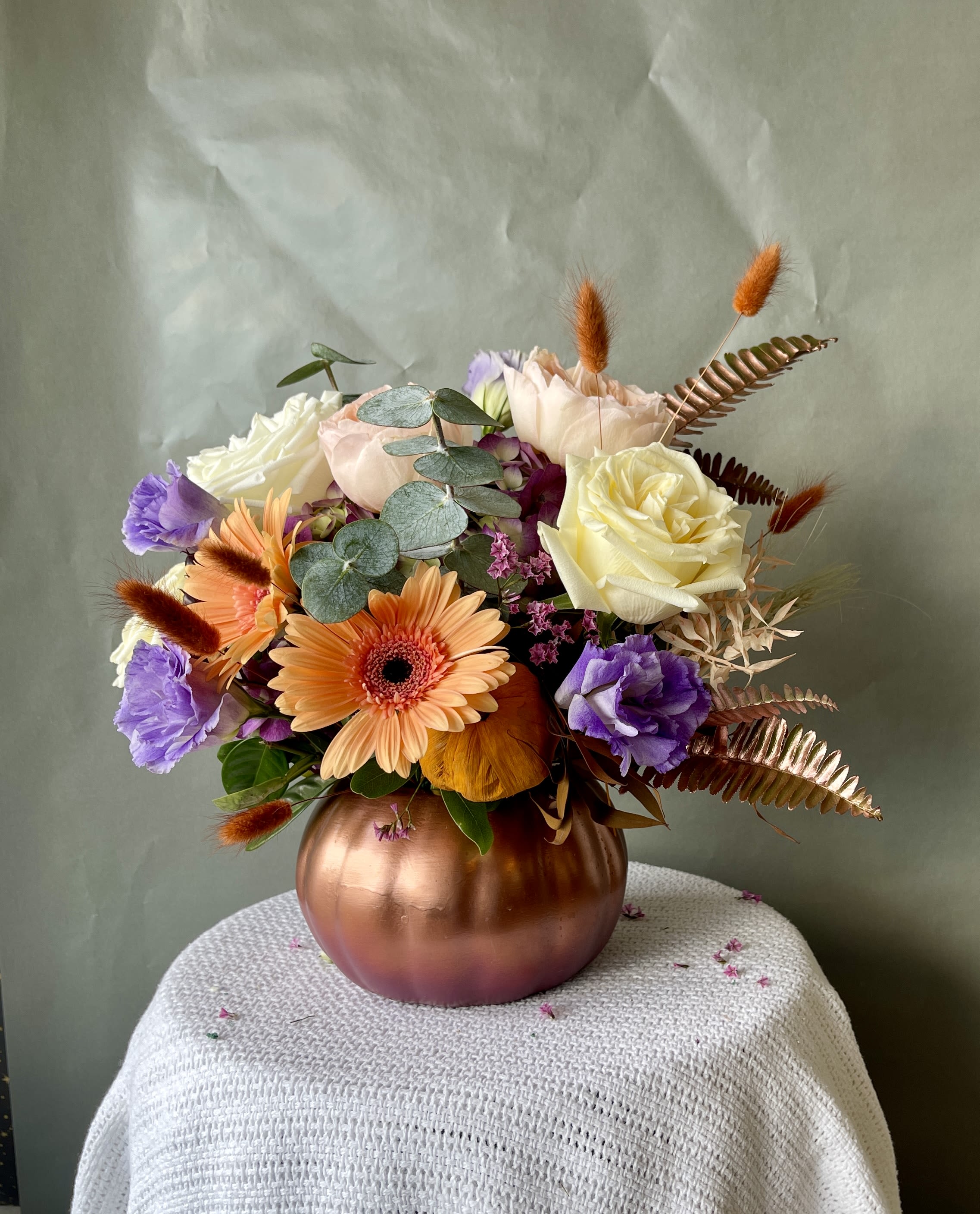 Pumpkin and Spice Pumpkin and Spice - Combine your Flower Power with Pumpkin Spice Aroma with this wonderful, dare we say “spicy,” seasonal arrangement. Housed in a ceramic pumpkin vase, you will surely “fall” in love with this collection of fall flowers this fall.