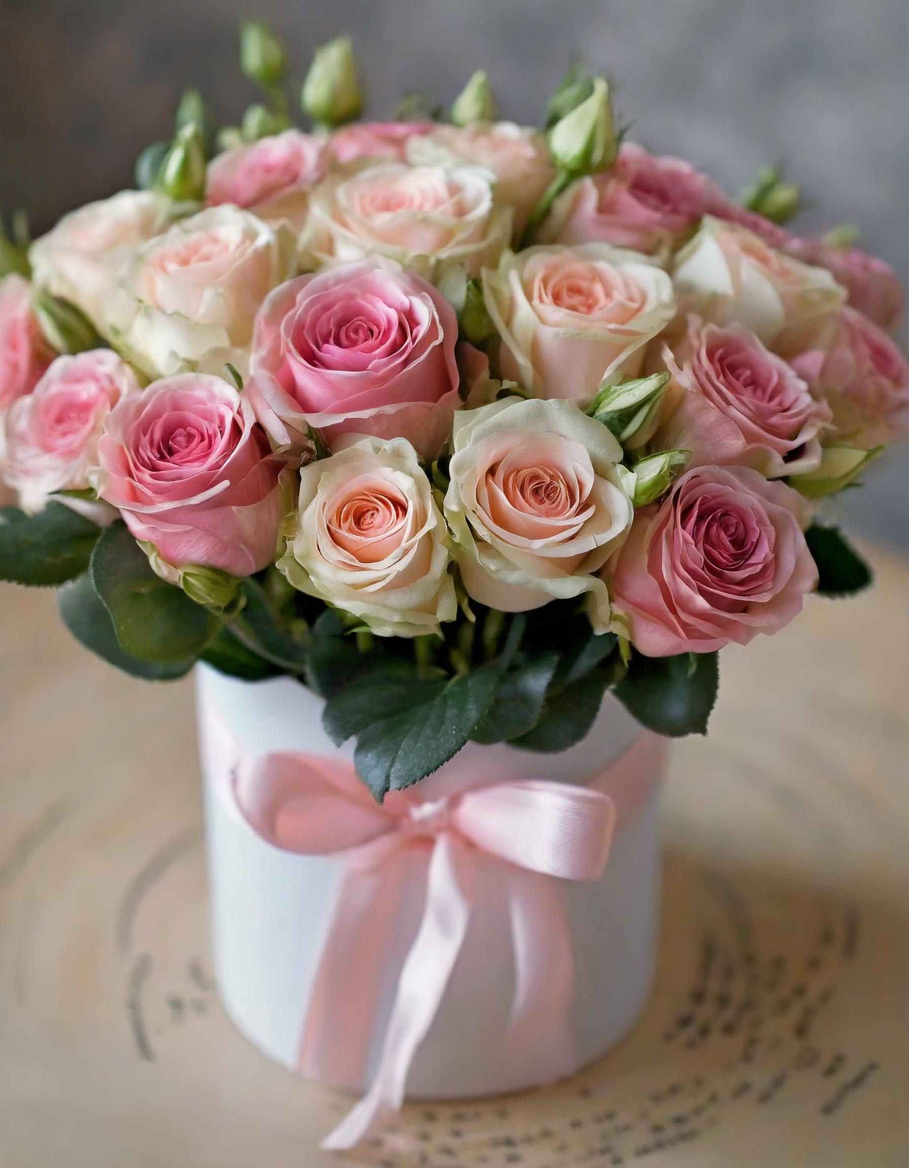 Beloved Bouquets Beloved Bouquets - A hatbox filled with a delicate arrangement of cream, and light pink roses exudes elegance and charm. Their soft tones symbolize warmth and affection, expressing sentiments that transcend mere words. When presented in a luxurious hatbox, these roses become not just a gift but a beautiful gesture of love and admiration.