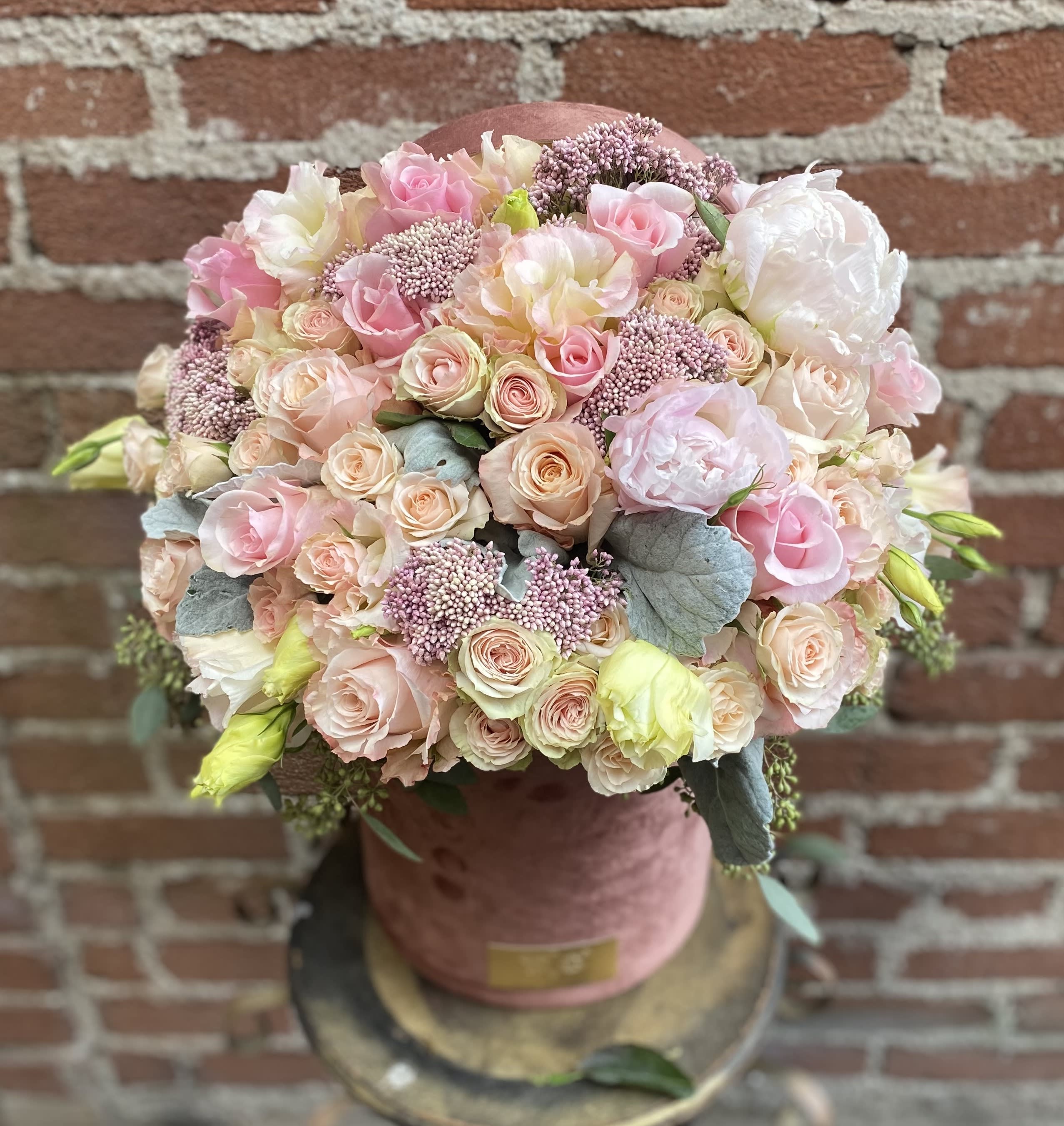 Vivian - Buzzy Bee Flowers - This beautiful arrangement is designed to deliver happiness to a loved ones day. Filled with beautiful flowers in a red box and customized to perfection, this arrangement is a showstopper! If you want to turn heads then this is the arrangement for you!  