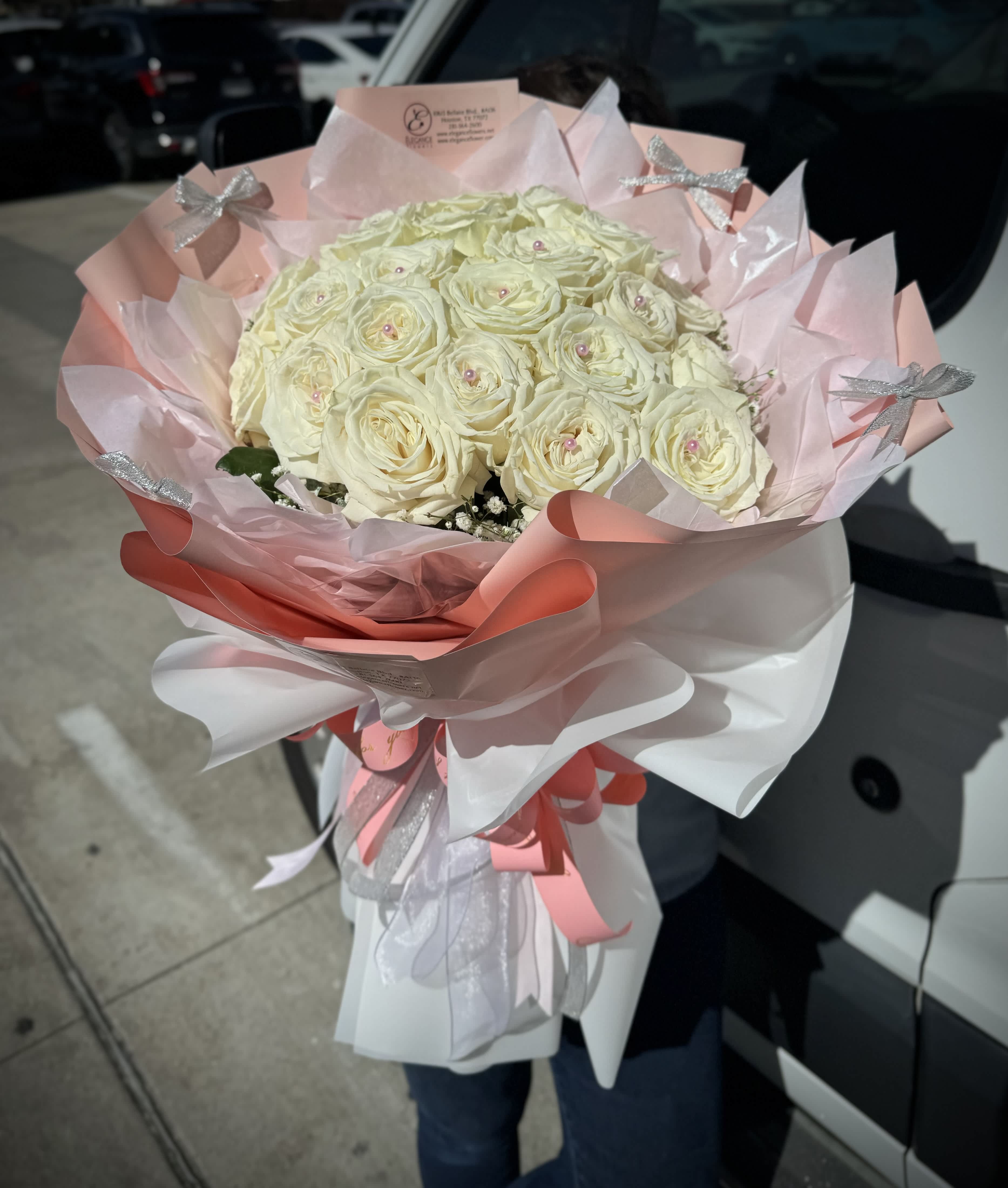 Wrapped Bouquet #10 Wrapped Bouquet #10 - A wrapped bouquet of flowers is a beautifully arranged collection of blooms, carefully selected and elegantly wrapped in decorative paper or fabric. These bouquets often feature a mix of fresh, vibrant flowers, and complemented by lush greenery. Wrapped bouquets are perfect for any occasion, from expressing love and gratitude to celebrating special moments, offering a thoughtful and visually stunning gift.