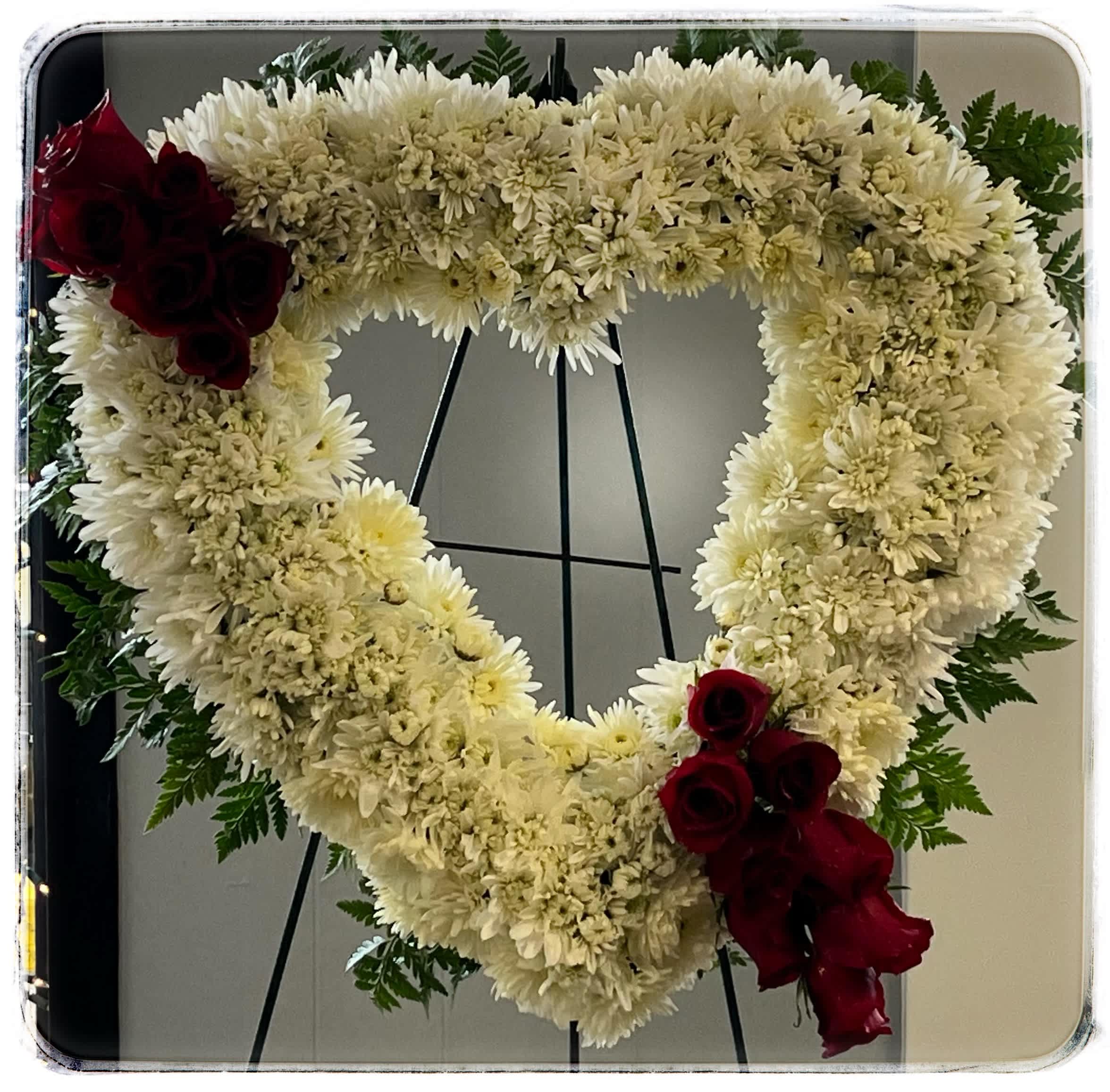 Bleeding Heart Bleeding Heart - This is a sympathy arrangement that represents a bleeding heart.