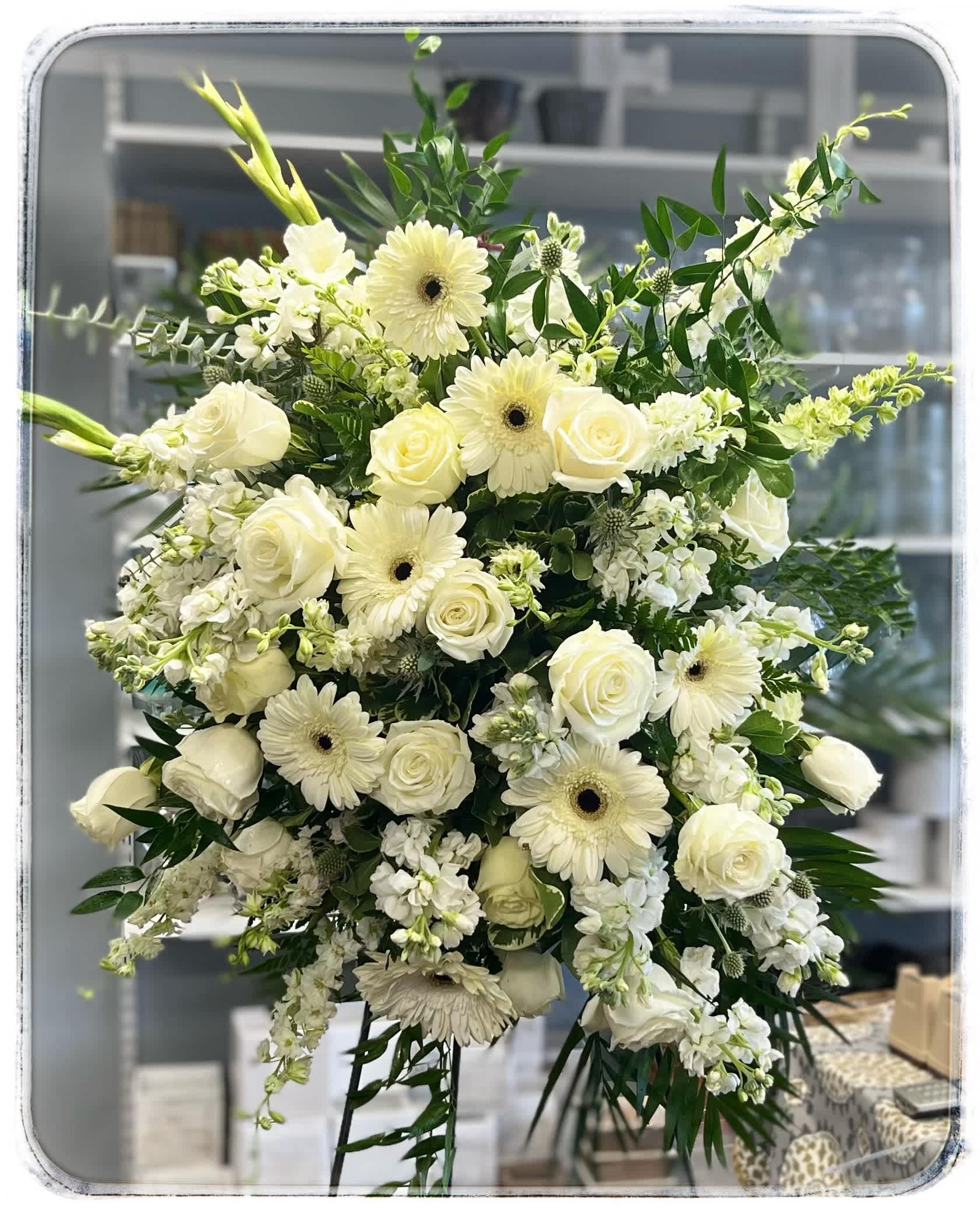 Amazing Grace Standing Spray Amazing Grace Standing Spray - This sympathy spray is in shades of white and a classic design.