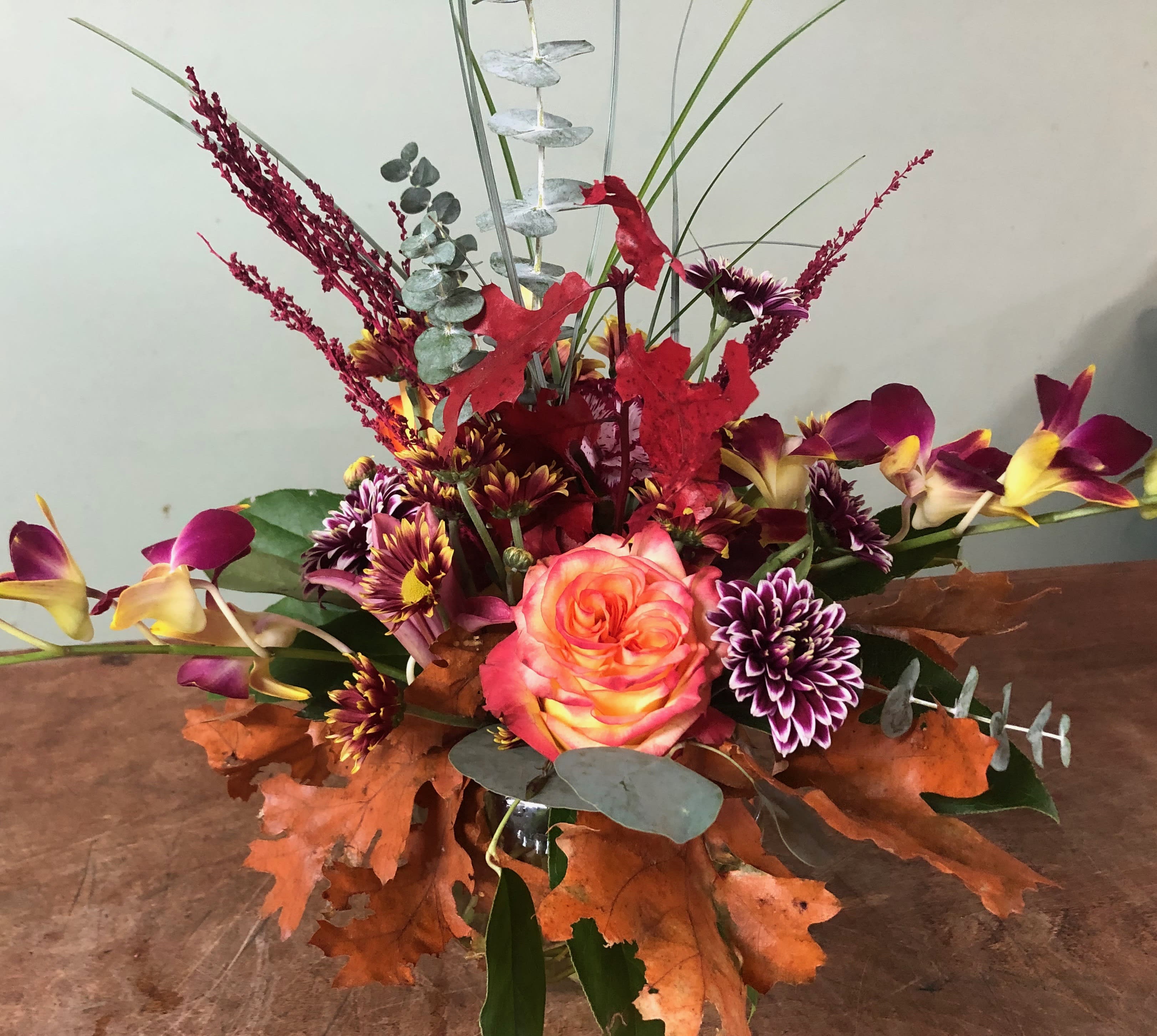 Flower Fields  - Autumn centerpiece filled with fall flowers and leaves.