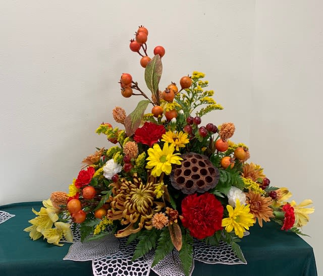 Happy Harvest Centerpiece - A bright and fun mix of vibrant Fall shades. Colors may vary due to availability.