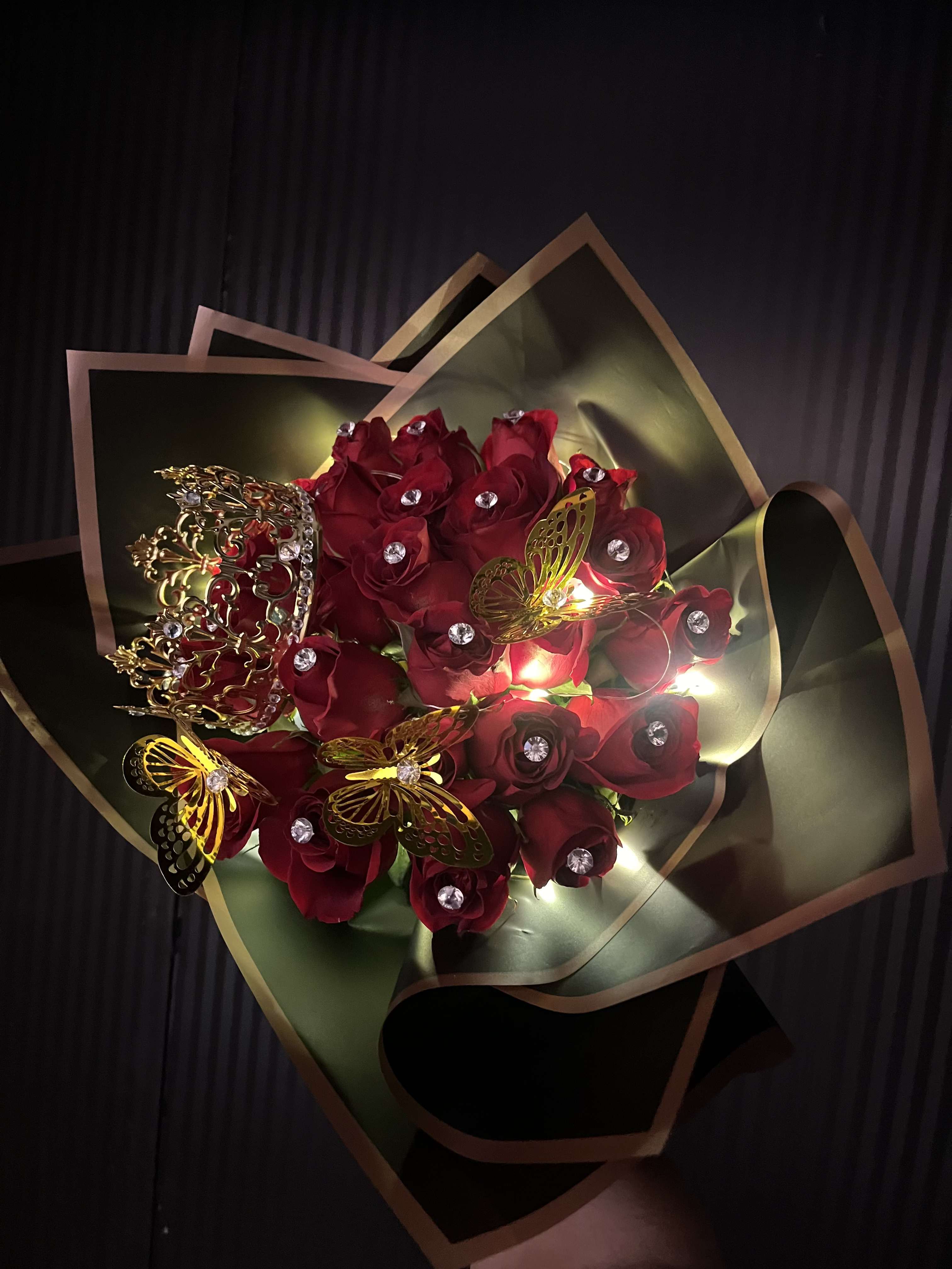 illuminated night - 25 long stemmed roses, with a gem pin in each rose, led light, foiled butterflies, and crown