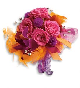 Dance 'til Dawn Corsage Dance 'til Dawn Corsage - Light up the night in this bright blend of purple dendrobium orchids, hot pink spray roses and orange feathers. Purple dendrobium orchids, hot pink spray roses and purple gomphrena accented with orange feathers. Approximately 5 1/2" W x 5 1/2" H Orientation: N/A