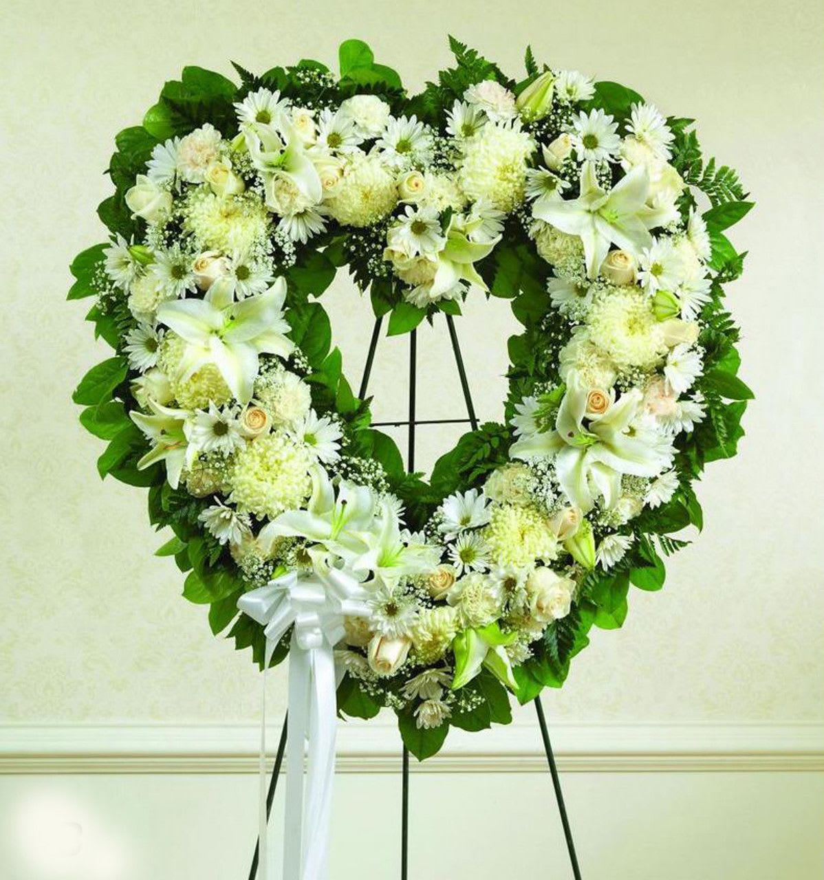 All White Hollow Heart All White Hollow Heart - All White Hollow Heart made with Carnations, Roses, Lilies, Carnations and fillers.