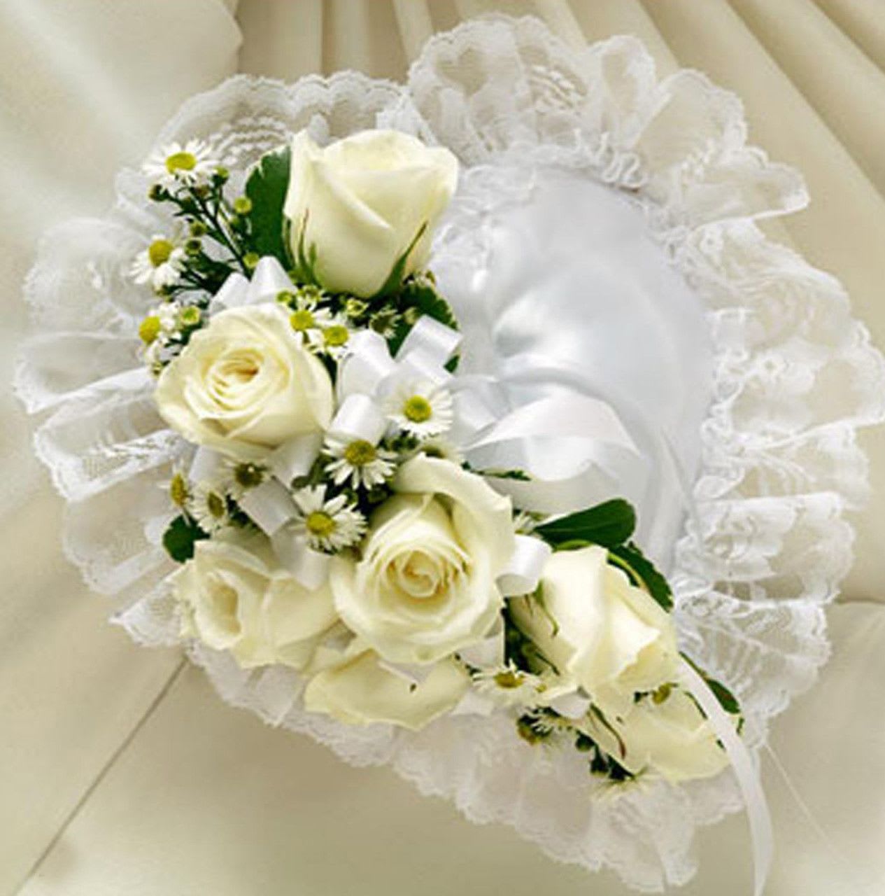 All White Casket Pillow All White Casket Pillow - Beautiful satin pillow with flowers in the center.
