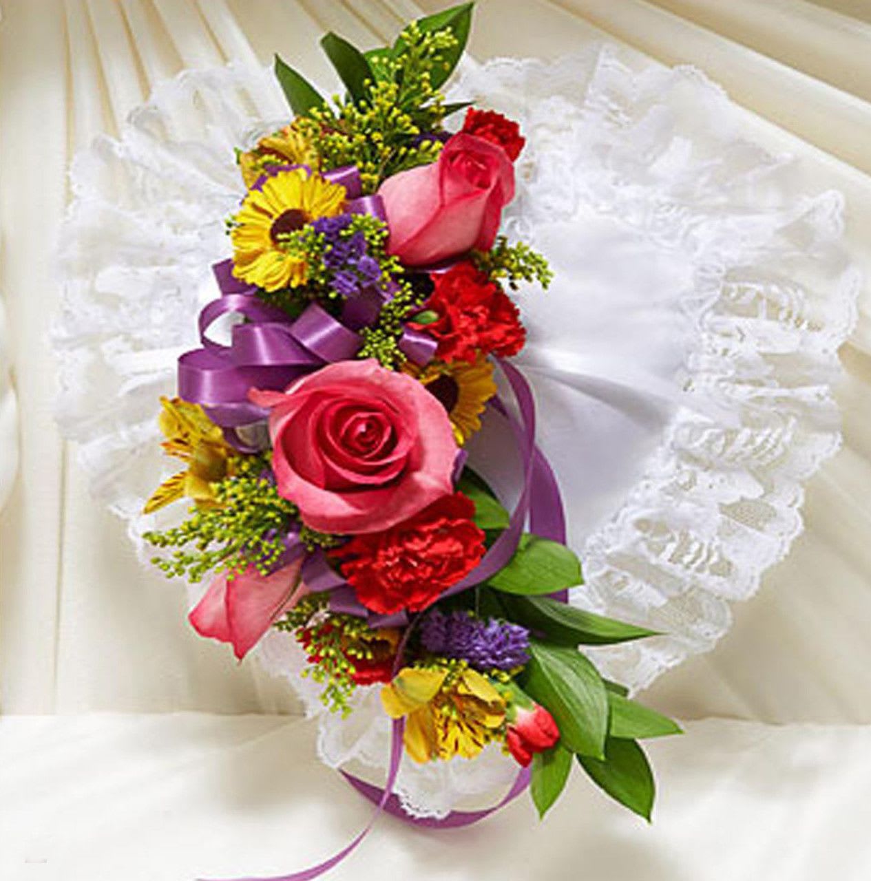 Mixed Casket Pillow - Beautiful satin pillow with flowers in the center.
