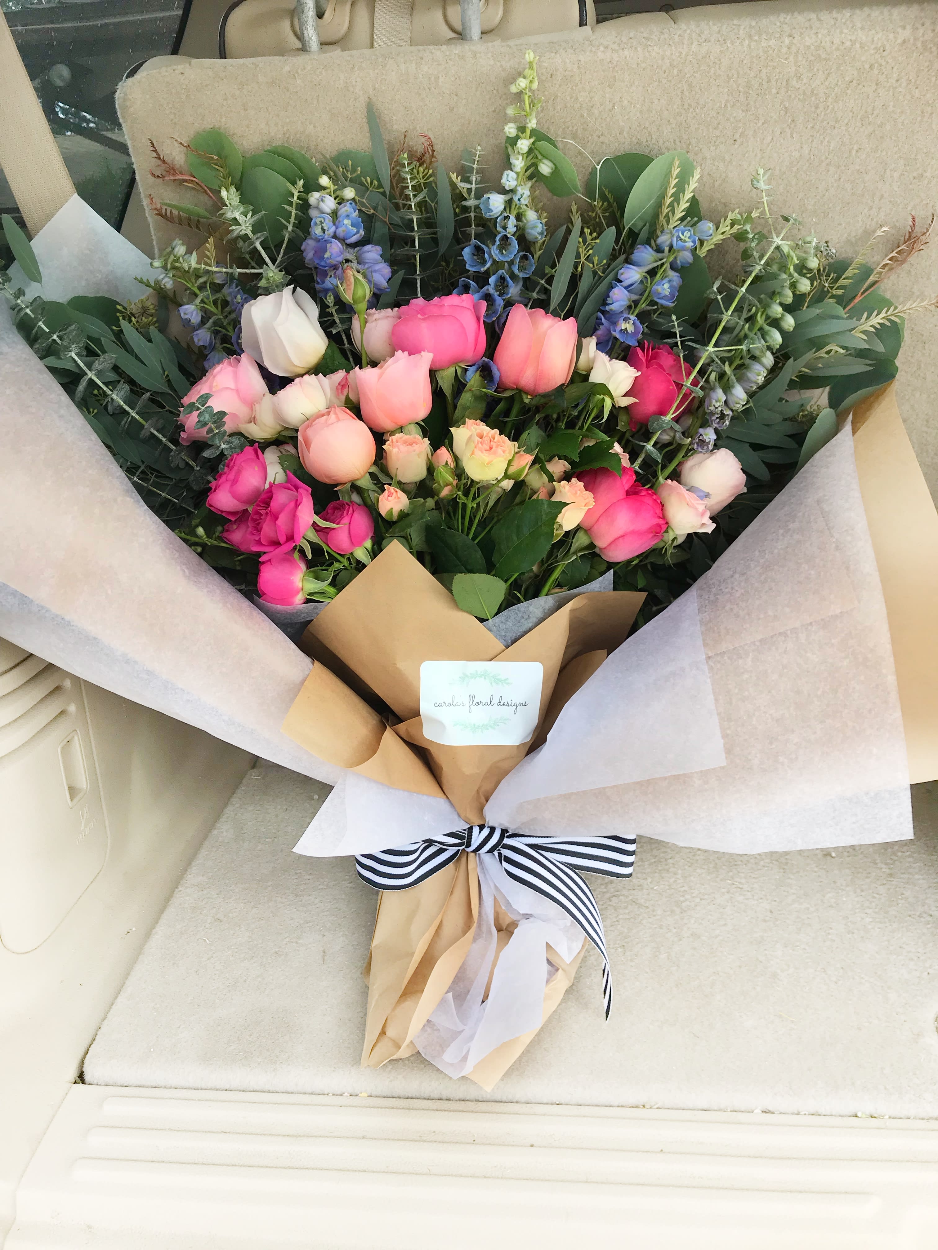 Bloom n' Wild Bloom n' Wild - Rose medley, gorgeous natures greens wrapped in paper with ribbon.