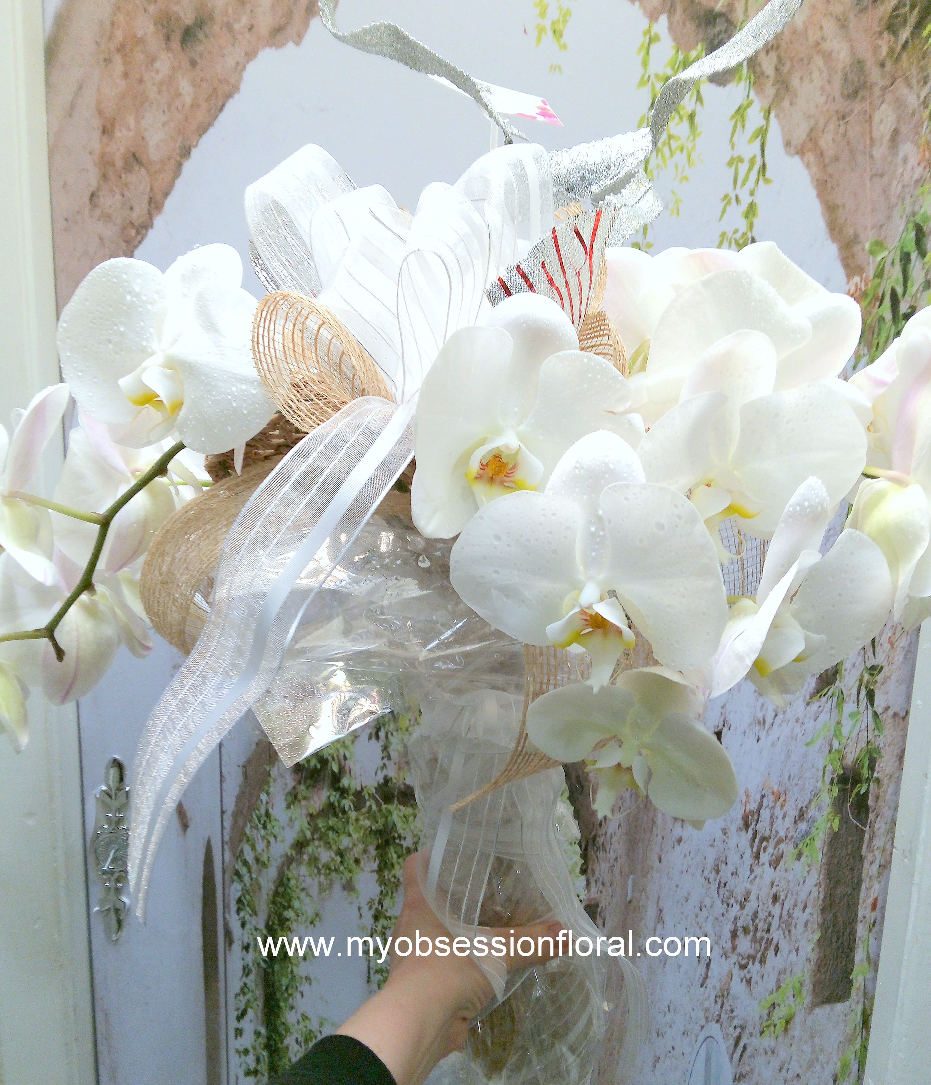 Bouquet of orchids. - Fresh orchids in fancy wrap. Very impressive, no vase. One of my favorites. 