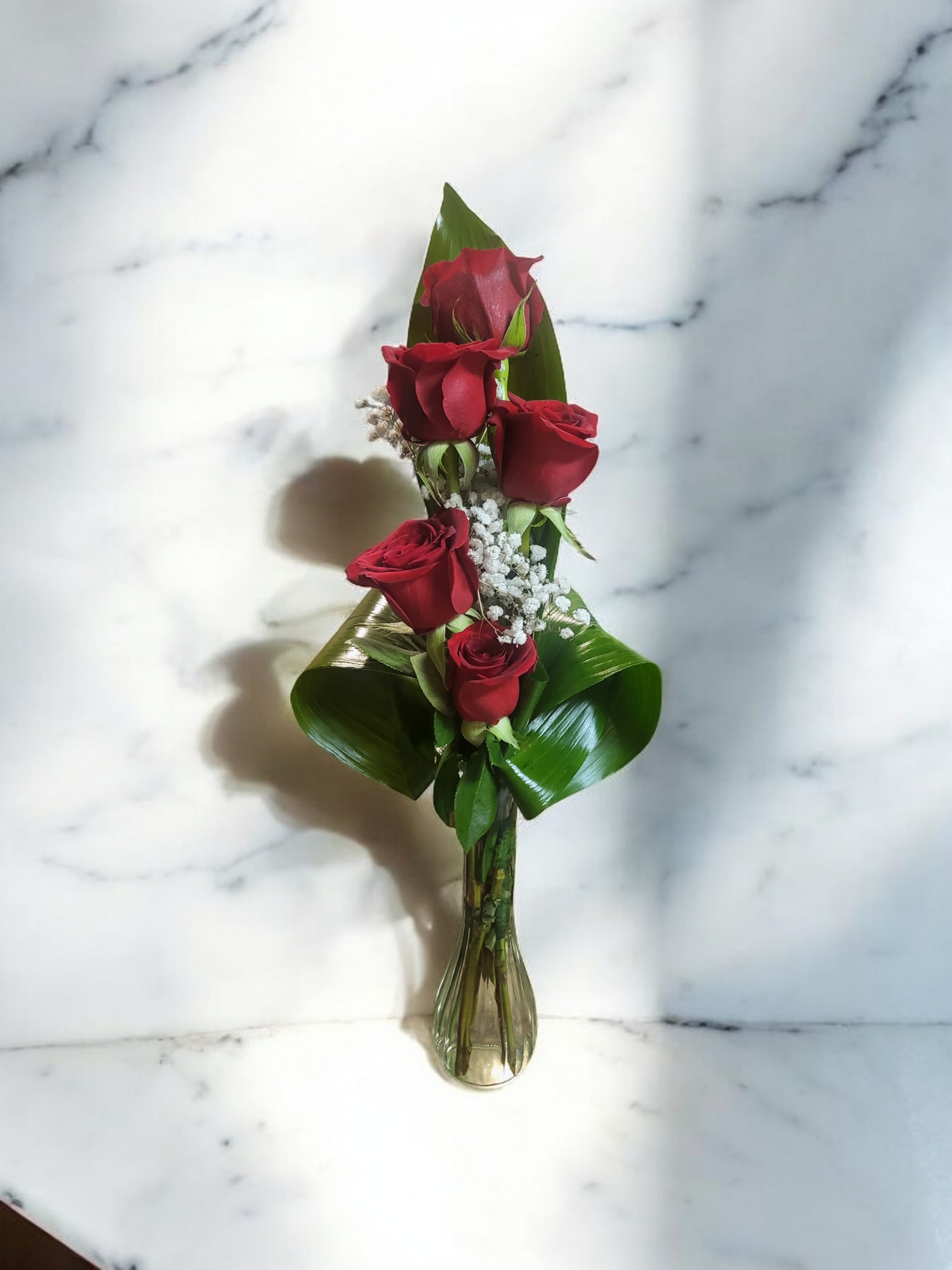 My Cuitie Pie My Cuitie Pie - Five red roses designed in a bud vase and adorned with baby's breath.