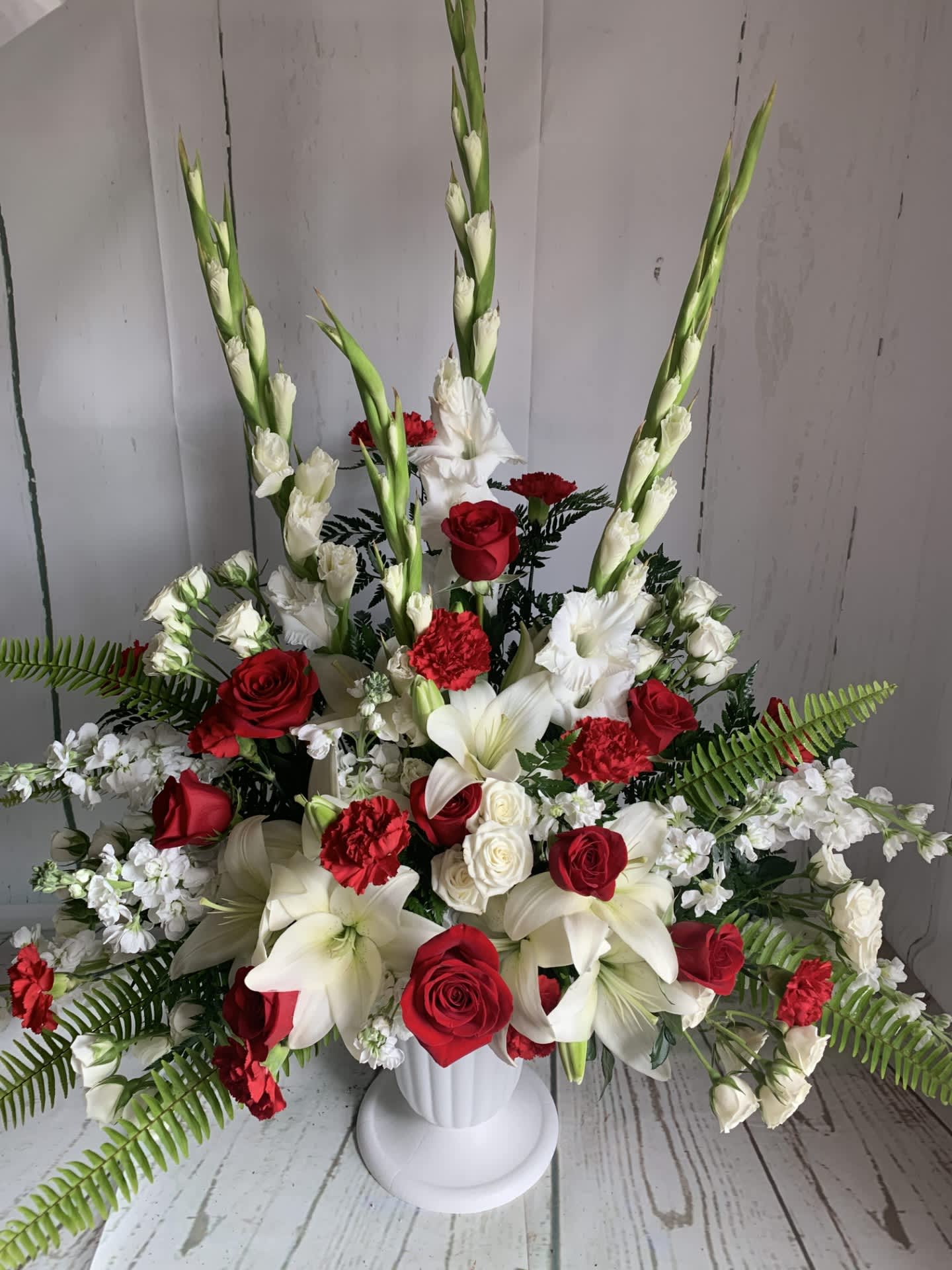 Memorial Flowers - This is a set of fresh flowers arranged in a white container. This can be used for a funeral or memorial service.  It can be customized as well so please call if you have any special requests.   Please note, these photos are meant to serve as an inspiration for color and style. Due to the seasonality of flowers, these arrangements cannot always be identically replicated.   Please contact us at 607-257-3203 with any questions.