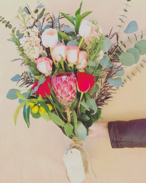 Summer Burlap Bouquet Summer Burlap Bouquet - Beautiful blooms wrapped in a burlap fabric. Roses, proteas, eucalyptus, stock, greenery.