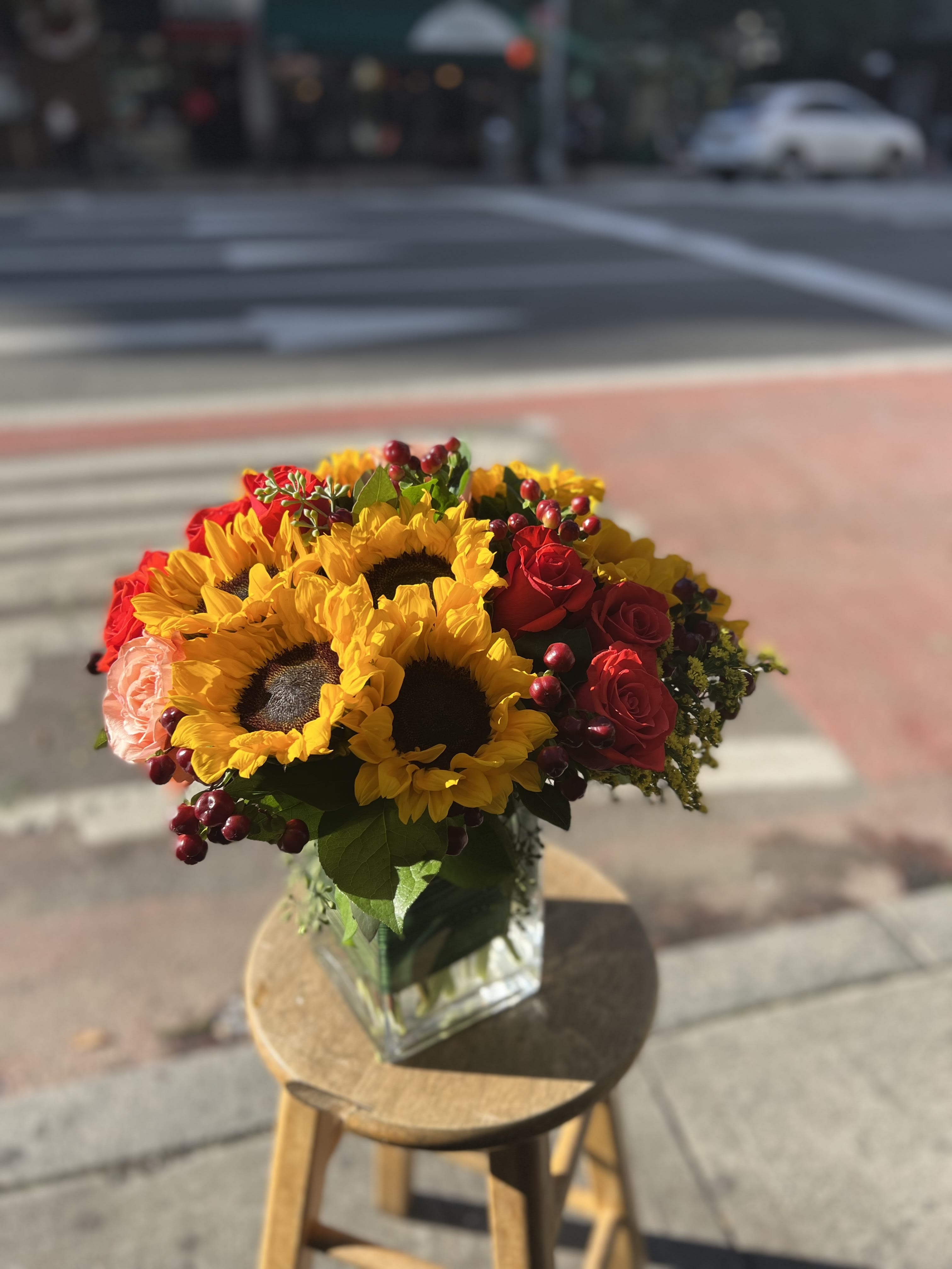 Sunflower fire - A beautiful sunflower and rose arrangement. The perfect gift to brighten up any space.