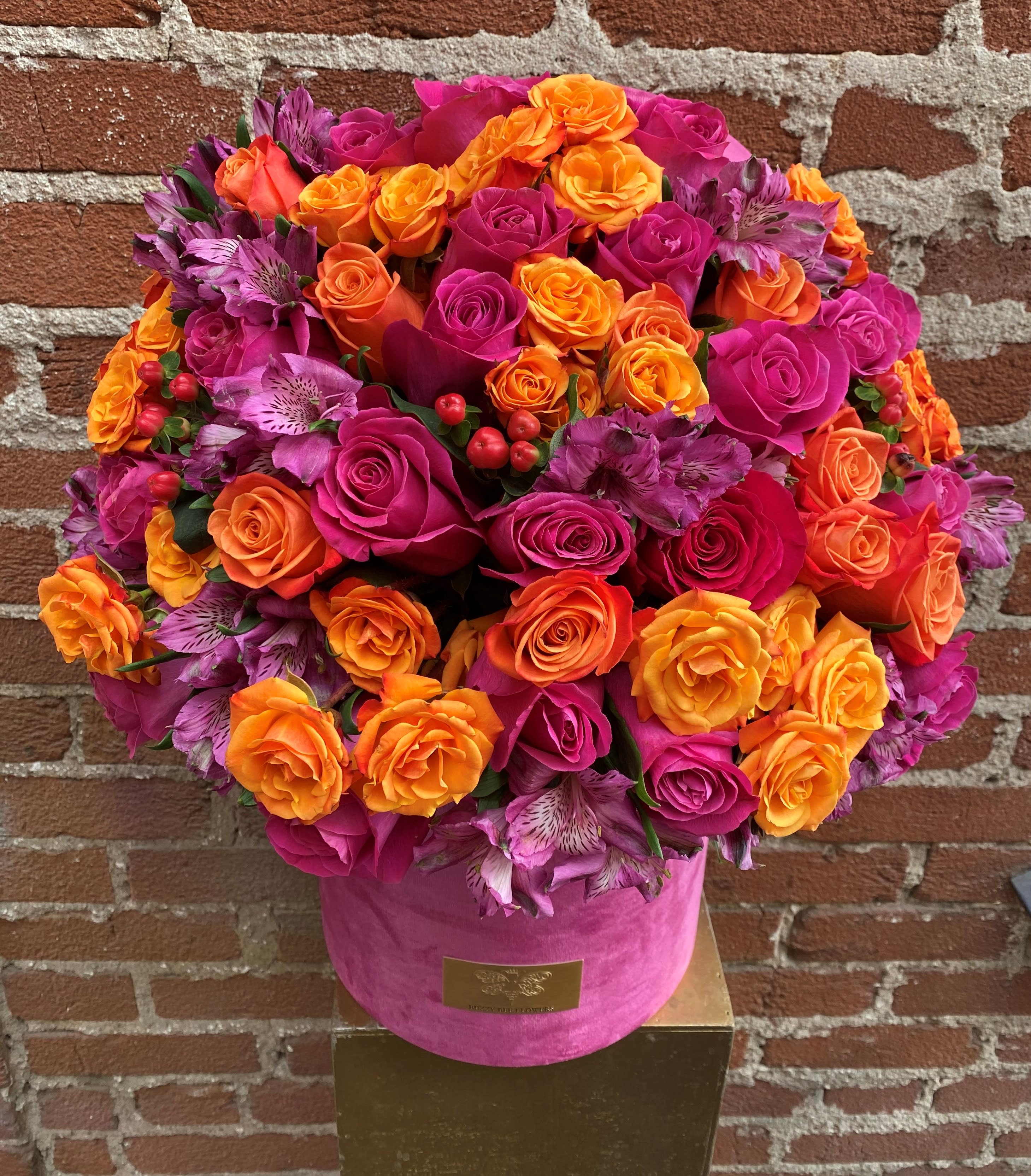 Summertime Brightness- Studio City Florist - This Vivid Arrangement is sure to bring Brightness with its BRIGHT and BOLD colors to a loved ones day! Filled with Roses from the Netherlands this dreamy Arrangement is bound for the WOW factor!  