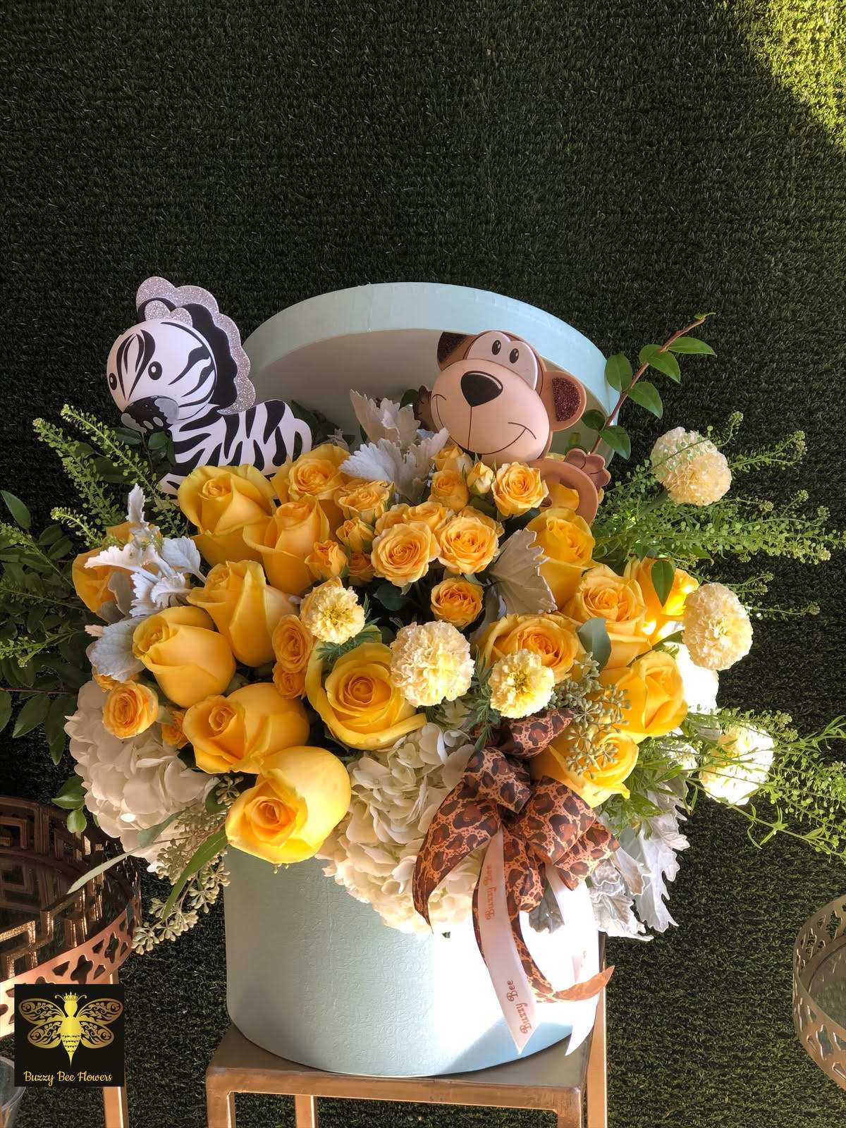 Baby Blue - Studio City Florist - This beautiful arrangement is designed to deliver happiness to a loved ones day. Themed for a baby boy it is filled with beautiful flowers and customized to perfection, this arrangement is a showstopper! If you want to turn heads then this is the arrangement for you!
