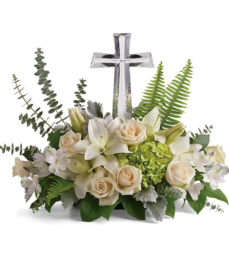 Life's Glory Bouquet - This peaceful bouquet of soft white flowers and green accents is a beautiful message of sympathy, adorned with a large crystal cross keepsake. Green hydrangea, crème roses, white asiatic lilies, and white alstroemeria are accented with dusty miller, sword fern, spiral eucalyptus, and lemon leaf. Delivered with a Large Crystal Cross Keepsake. Approximately 22 1/2&quot; W x 18&quot; H