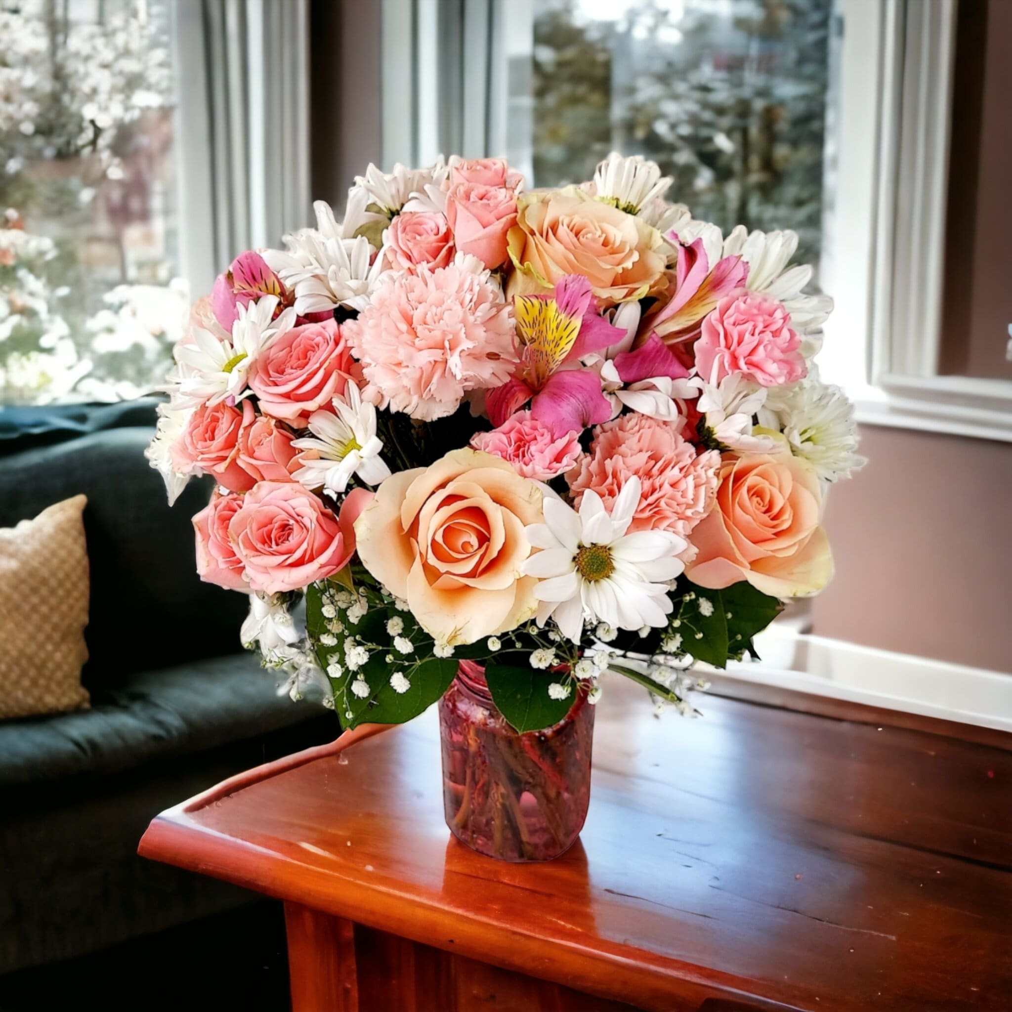 Adina - Looking for a gift that's sweet, feminine, and sure to put a smile on someone's face? Look no further than Adina, our beautiful floral arrangement featuring a variety of pink and white blooms. This stunning arrangement is composed of pink roses, pink carnations, pink alstroemeria, white daisies, and baby's breath, all carefully arranged to create a truly breathtaking display.  Whether you're looking for a gift for a special occasion like a birthday or anniversary, or just want to brighten someone's day, Adina is the perfect choice. This versatile arrangement works equally well as a thank-you gift, a get-well-soon gesture, or just a way to let someone know you're thinking of them.  Approximately: 12&quot; W X 14&quot; H
