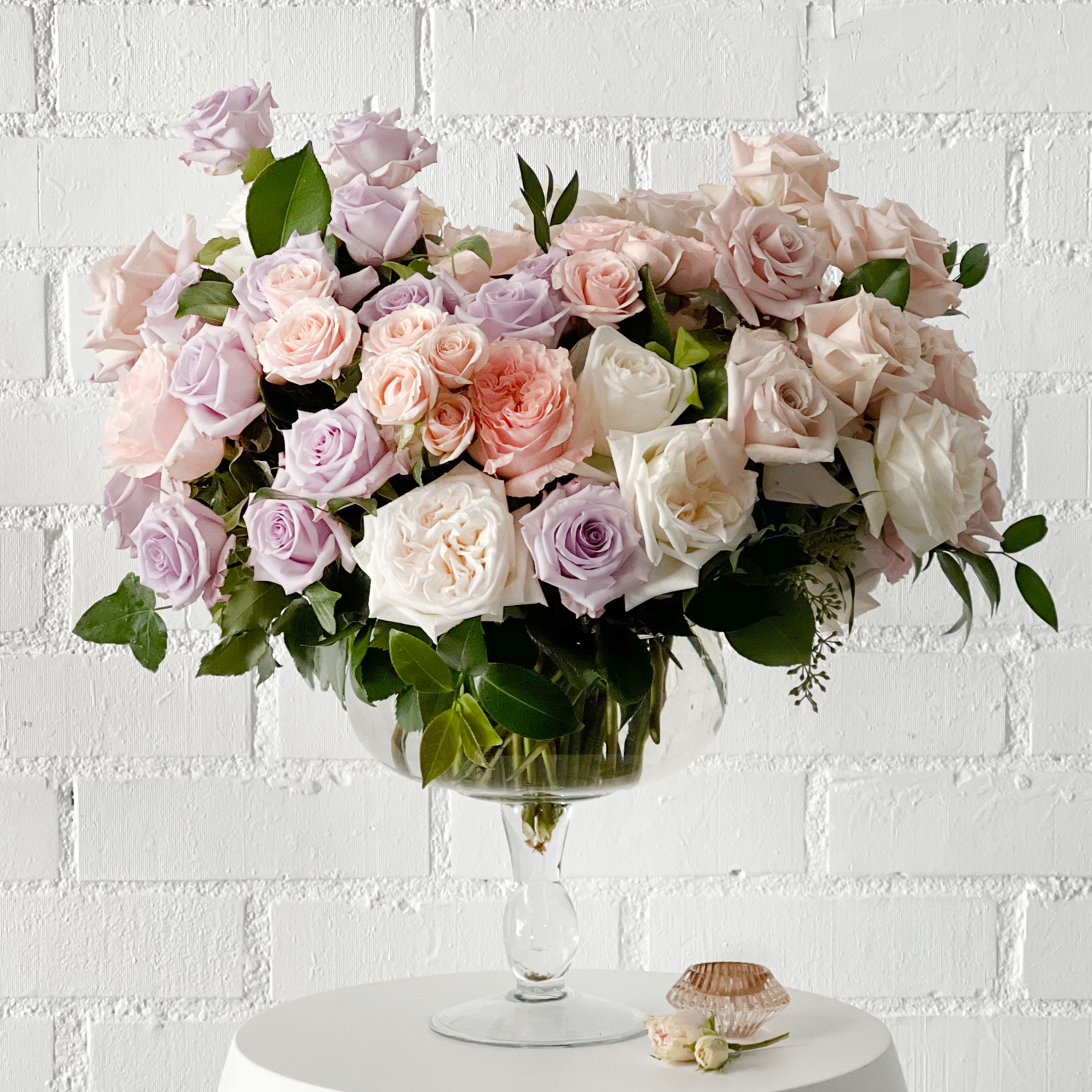 Passion Pastels Garden - Passion Pastels Garden is a sweet arrangement made with about 80 various Roses and greens. All placed in a Glass Pedestal 11&quot; Tall vase.  Measurements: Vase: 11&quot; Tall Arrangement: 18 Tall x 24 Wide