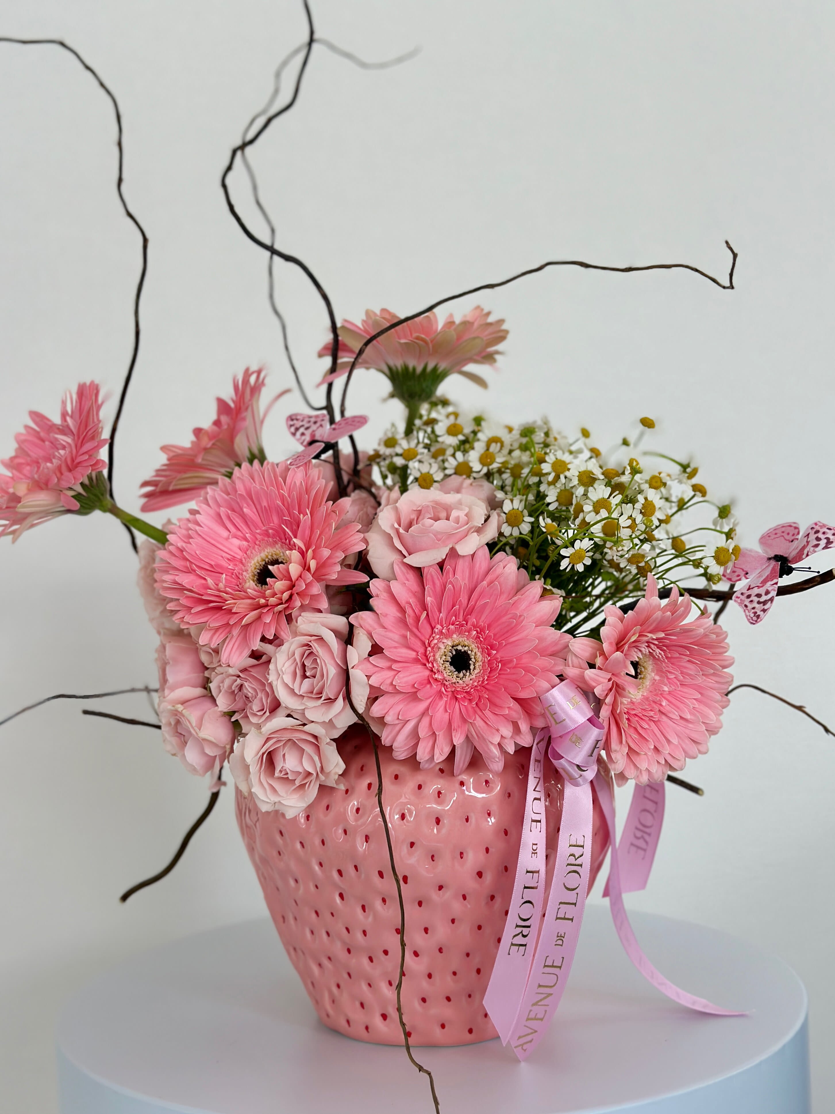 Berry Cute - Bring a burst of summer joy to your space with our Berry Cute arrangement. This vase not only holds your flowers but also adds a whimsical flair to any room, making it a delightful centerpiece for any occasion. 