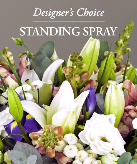 Designer's Choice Standing Spray - This will be a custom designed standing spray using the best florals available to honor your loved one. Often times we will coordinate what the family has ordered for the casket piece. 