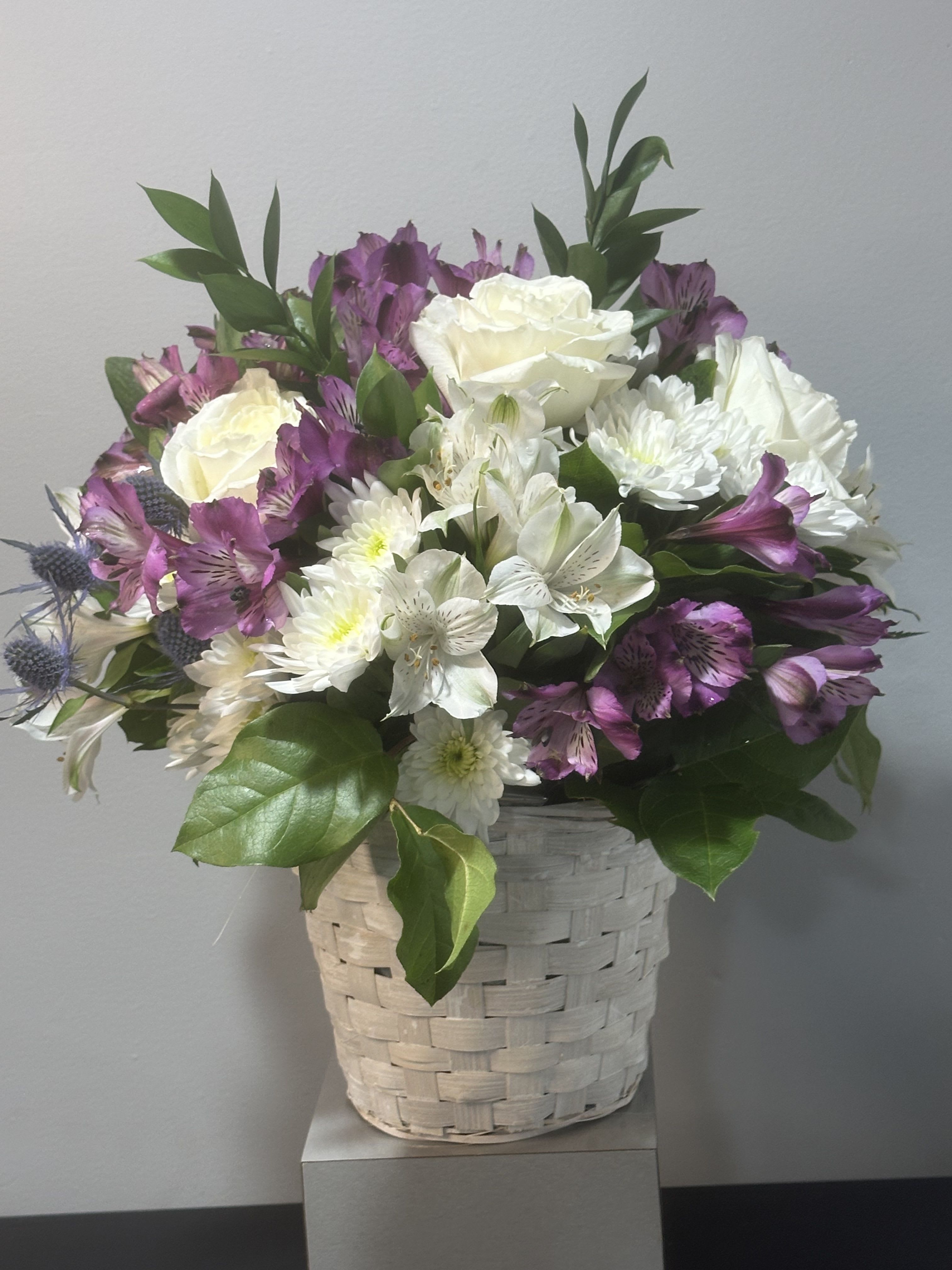 Basket of Blooms by Petals 2 Go Basket of Blooms by Petals 2 Go - A basket overflowing with beauty and blossoms.