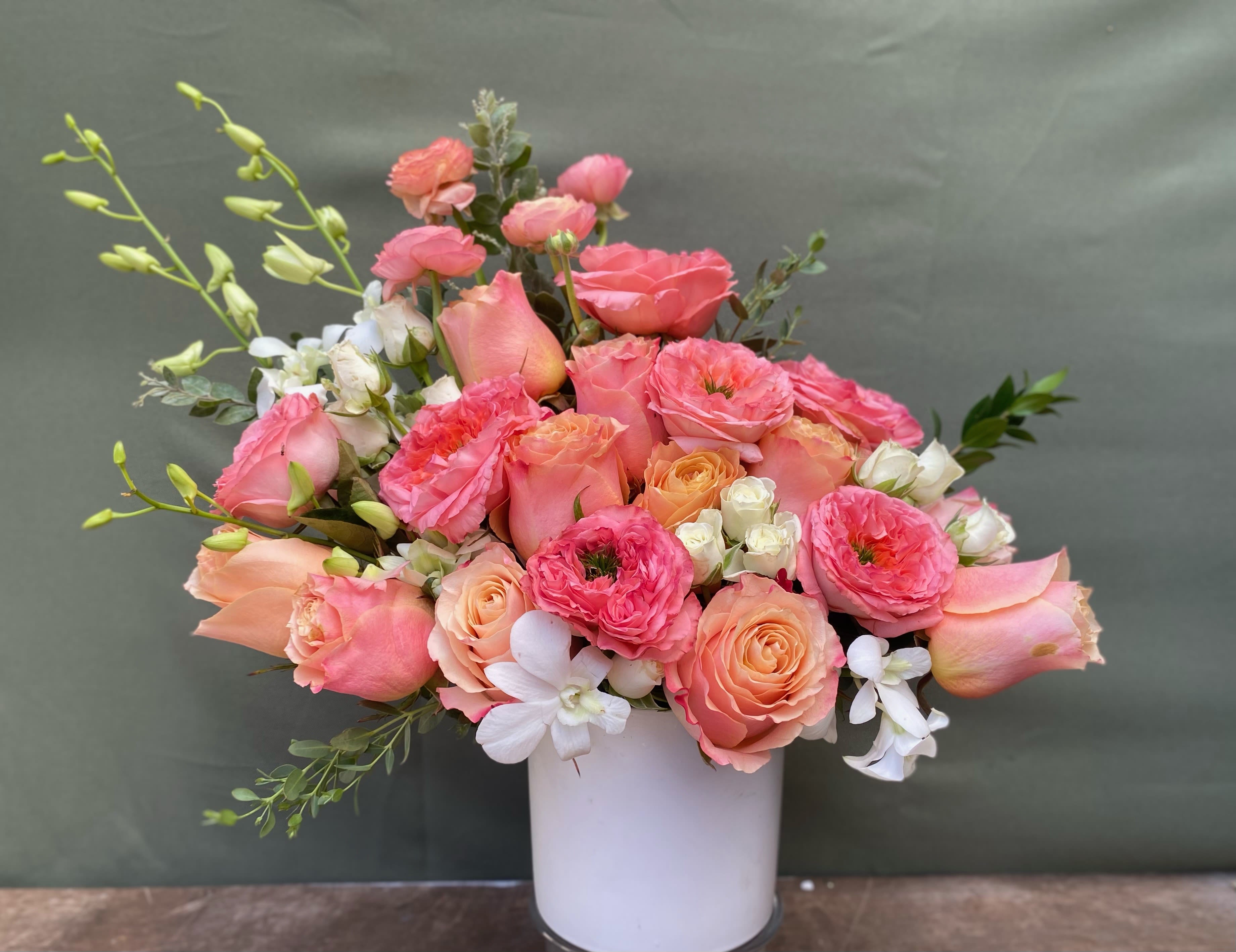 Peach Lover  - Pink and Peach flowers beautifully arranged in ceramic white vase.