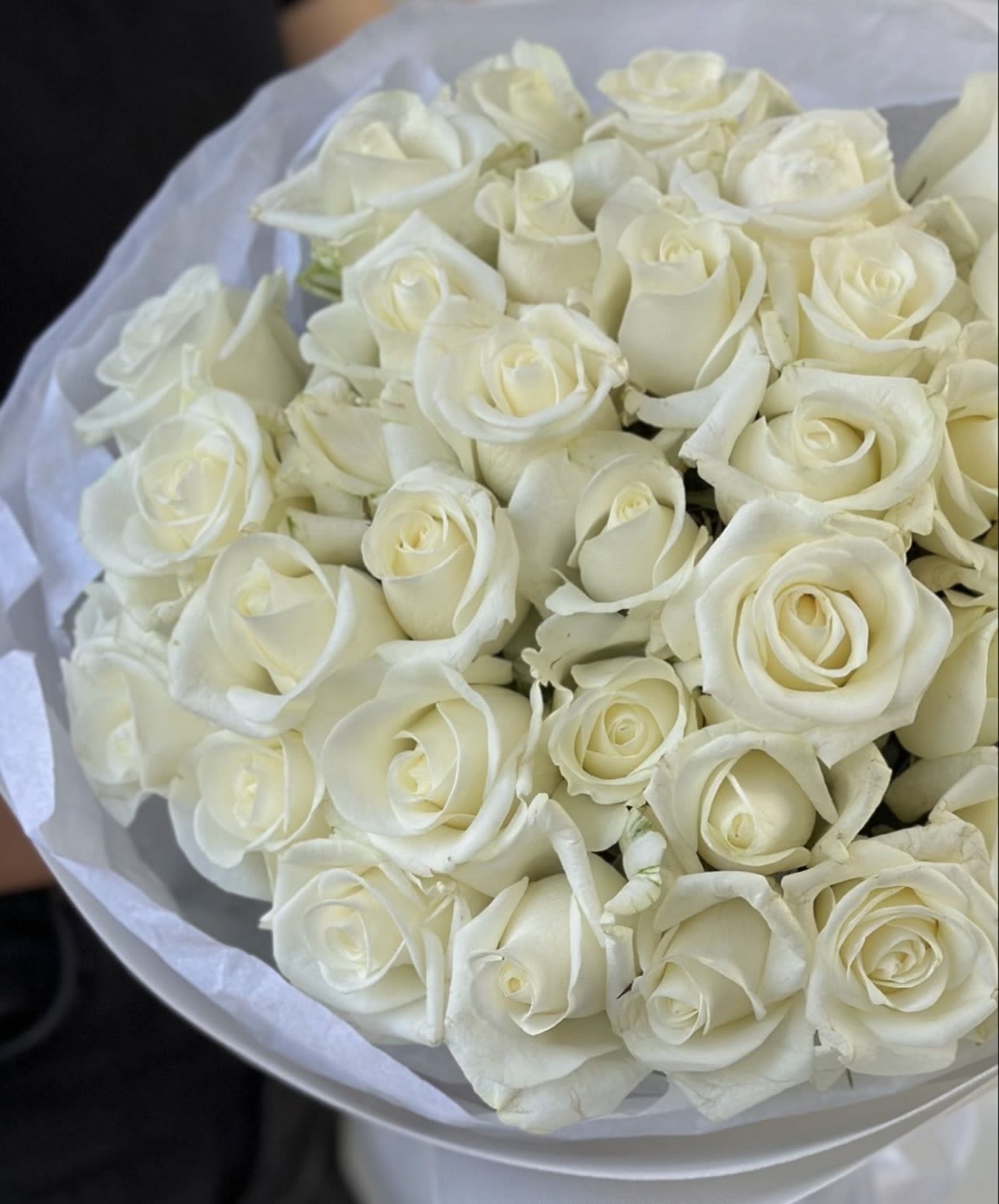 White Roses Bouquet White Roses Bouquet - Gorgeous white roses arranged in a vase Standard - 50 roses, on the photo Deluxe -75 roses Premium -100 roses
