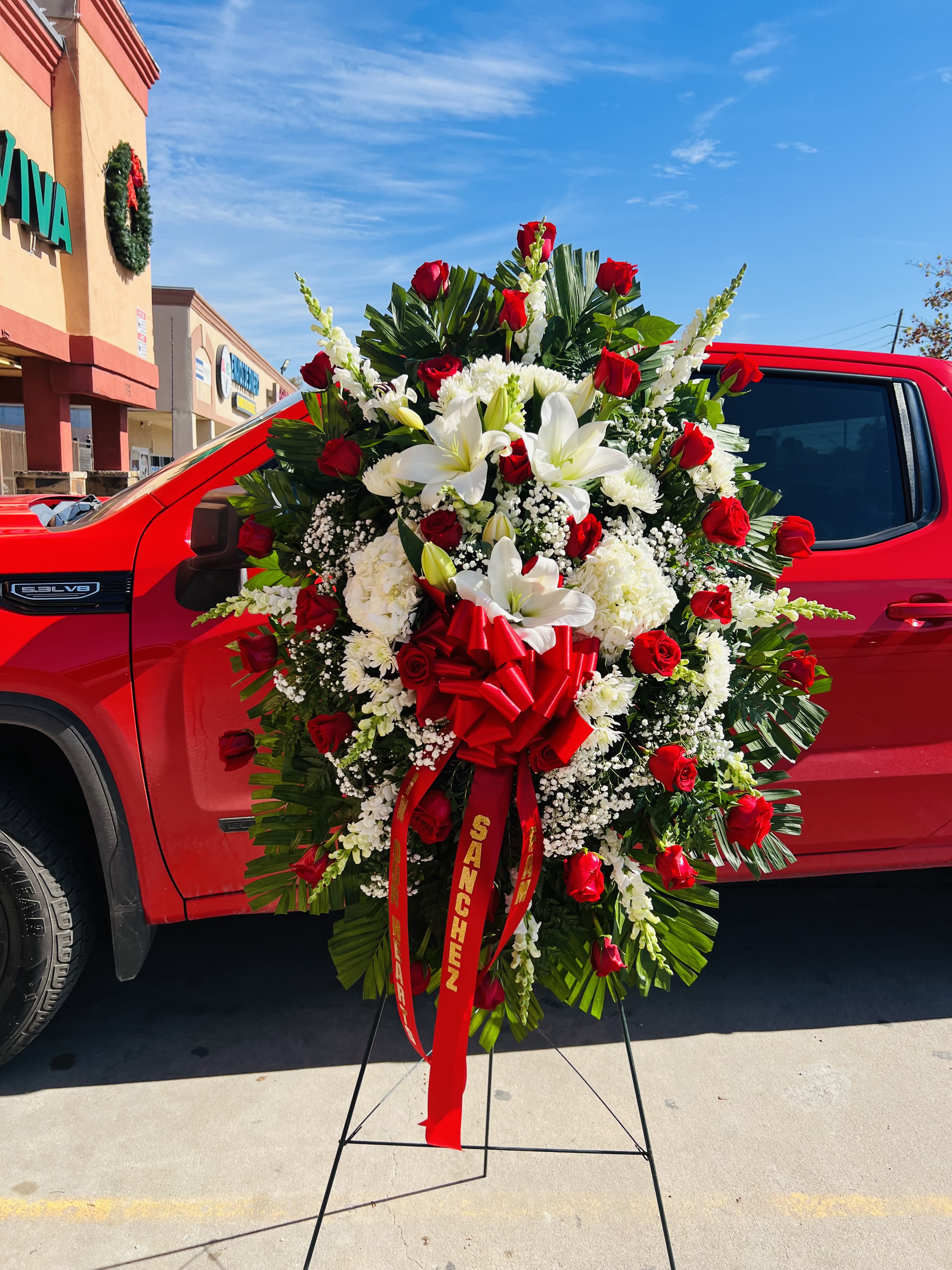 Red Sympathy Standing Spray - All red Large Sympathy standing Spray  Includes all red roses and white hydrangeas with filler green Metal stand included*