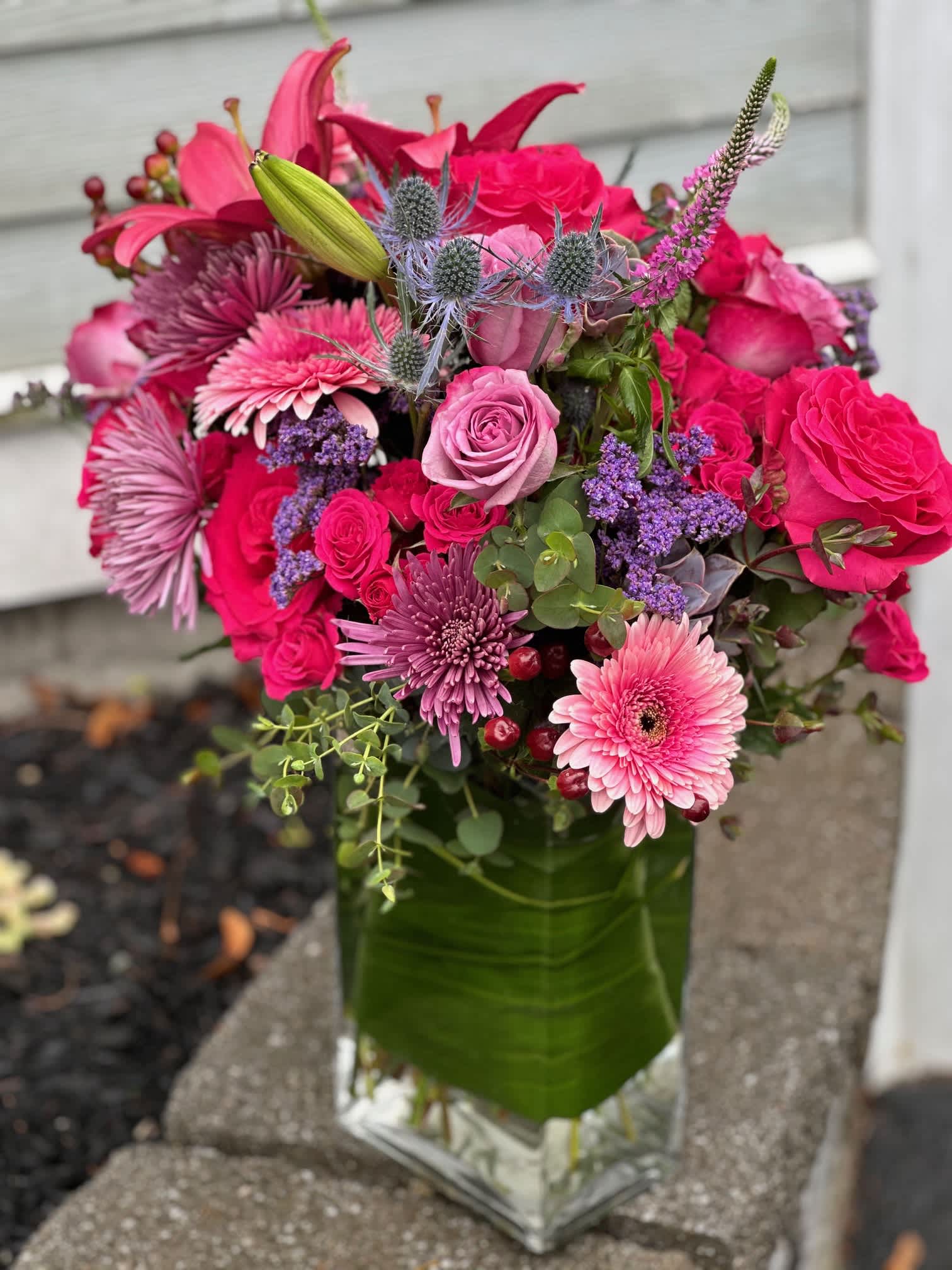 I Dream of Jean - A Beautiful arrangement of pinks and reds and ambers. Each of these arrangements are custom made for you, so although we may not have each flower exactly in the photo, know that we have over compensated to ensure your satisfaction. 