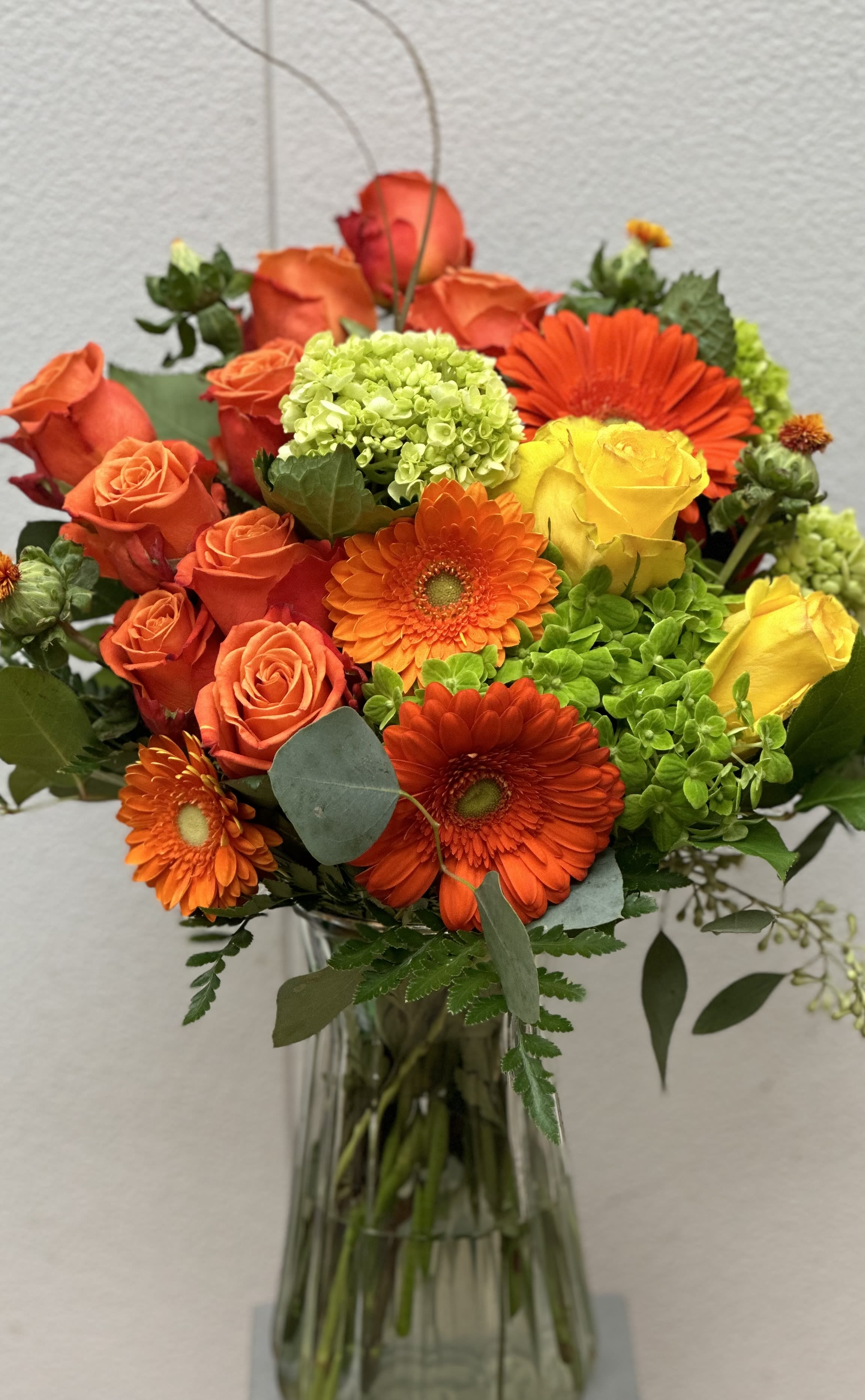 Autumn Glow by Petals 2 Go Autumn Glow by Petals 2 Go - Discover a burst of orange roses, gerber daisies and hydrangea with this autumn design.