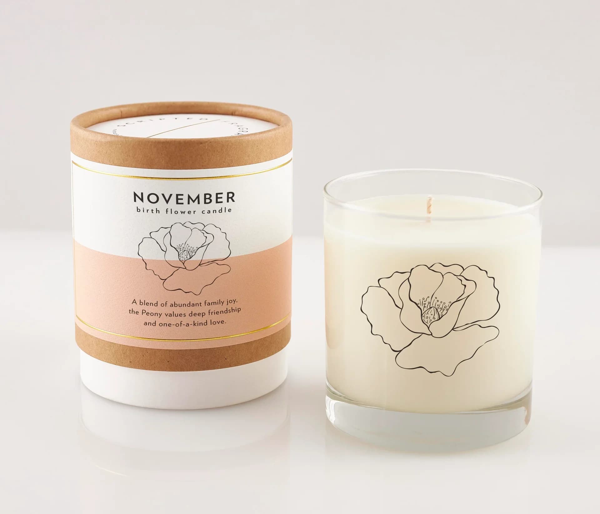 November Birth Month Flower Soy Candle, Wildflower Candle - As the year deepens into November, a time marked by the gathering of friends and the warmth of gratitude, our November Birth Month Flower Soy Candle captures the essence of this nurturing month through the beauty of the Peony. Known for its lush, full blossoms and rich symbolism of friendship, prosperity, and love, the Peony is a fitting tribute to those born in November.  In our unique fragrance interpretation for November, the luxurious and strong scent of Peony is beautifully complemented by the bright and vibrant notes of Magnolia. This combination creates an inviting, rich aroma that fills any room with a sense of camaraderie and heartfelt thankfulness.  Candle details: Hand poured, 100% soy wax Features a lead-free cotton wick Made with premium fragrance and essential oils Vegan and cruelty-free Free from dyes, additives, preservatives, petroleum, and harmful phthalates Reusable Rocks Glass is hand wash only Reusable Rocks Glass Candle Diameter | 3.5 in Height | 4 in Net Weight | 8 oz Up to 50 hours of burn time