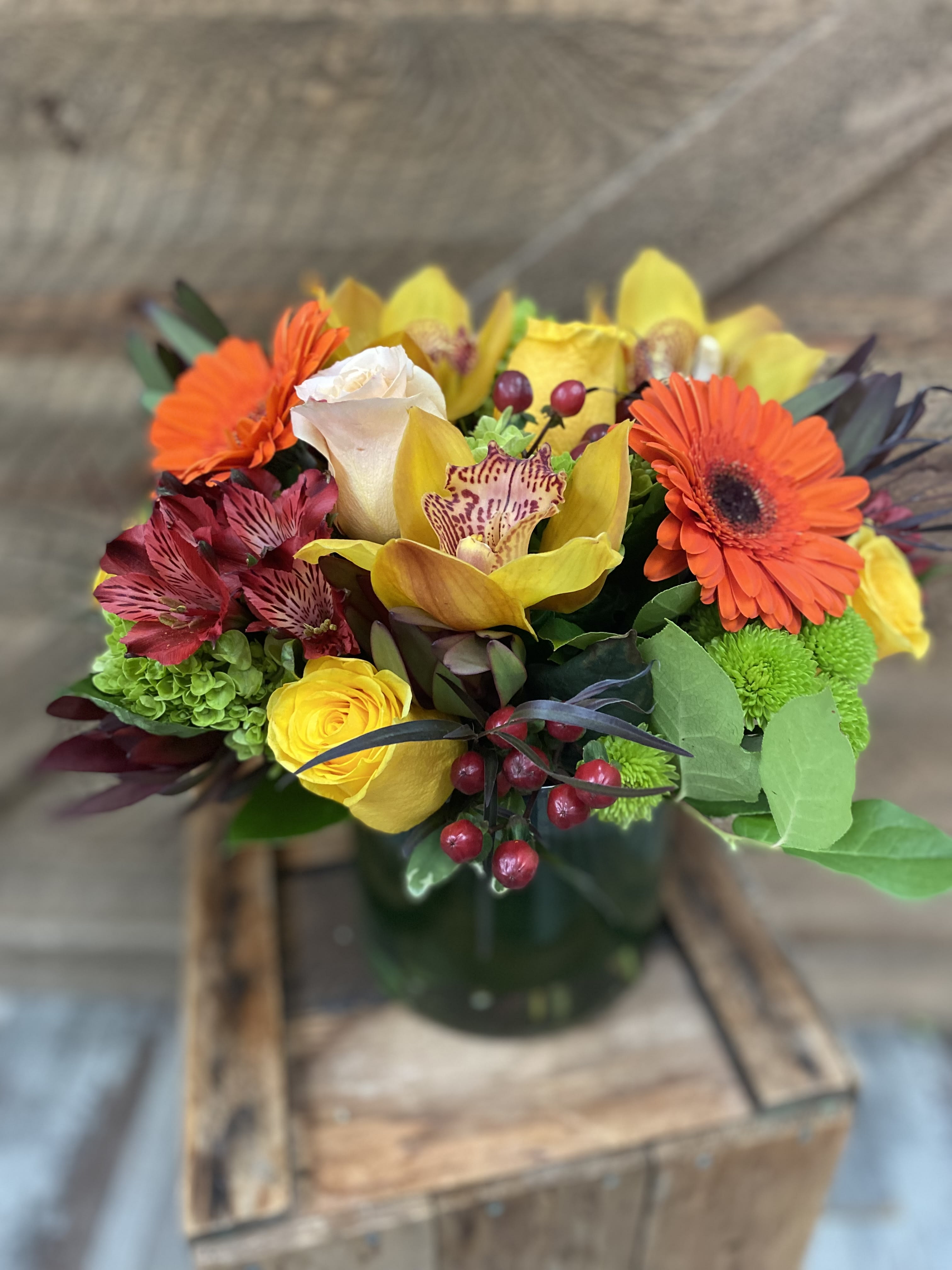 Chic Fall Chic Fall - Gorgeous cymbidium orchids accompanied by roses, hydrangeas, gerbera daisies, hypericum berries, protea, alstroemerias and more. Perfect holiday centerpiece. Version shown is the deluxe.