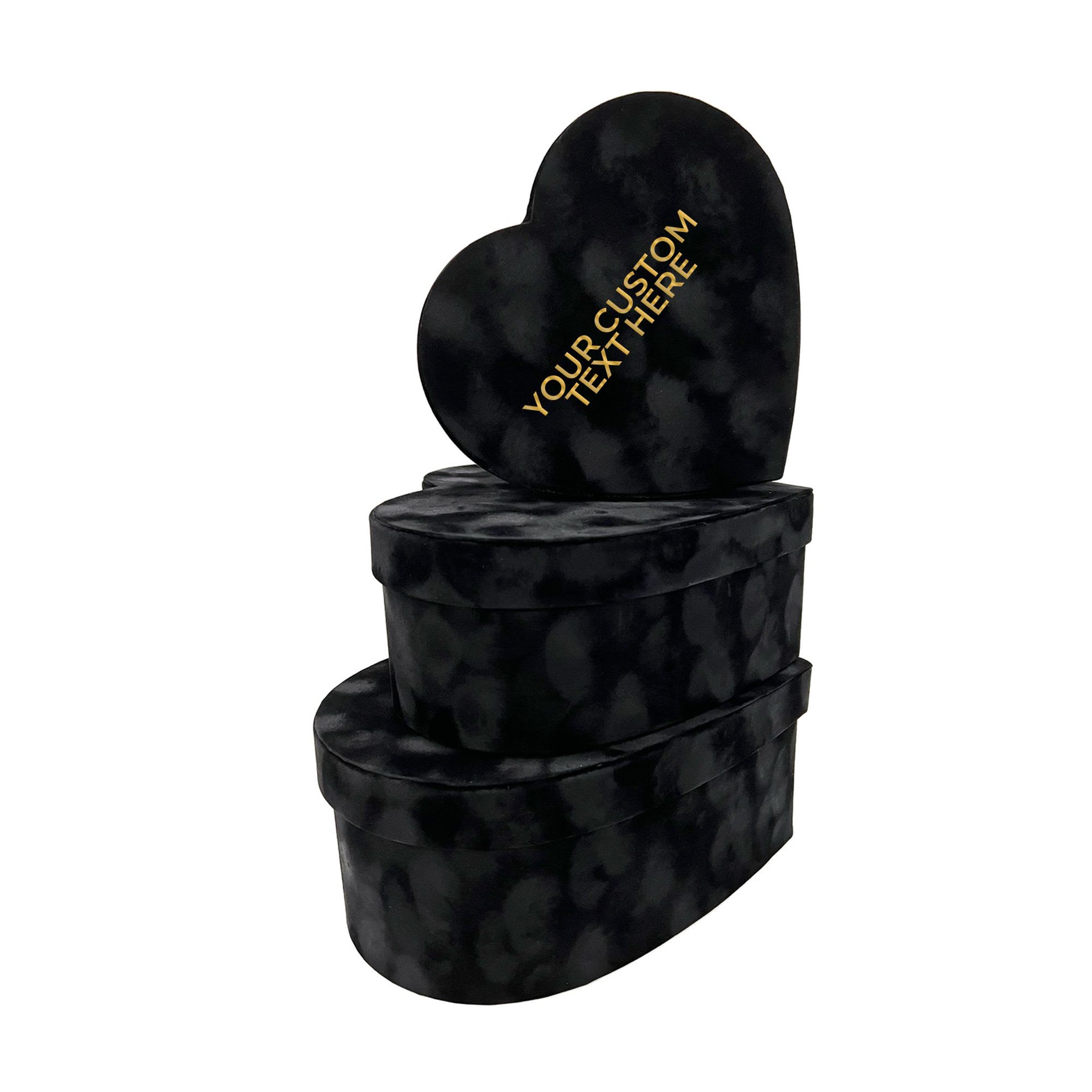 Custom Black Heart-Shaped Gift Box Set Custom Black Heart-Shaped Gift Box Set - Add a touch of sophistication to your gift-giving with our Custom Black Heart-Shaped Gift Box Set. This set includes three luxurious black velvet heart-shaped boxes, perfect for holding flowers, chocolates, or other personalized gifts. Each box in the set can be customized with your own message, making it a unique and thoughtful way to present your gifts. Ideal for romantic occasions, anniversaries, or even for elegant gift packaging, these boxes make a statement with their sleek design and customizable text. Features: - A set of three black velvet heart-shaped boxes. - All boxes can be personalized with custom text for a special touch. - Perfect for holding flowers, chocolates, or personalized gifts. - Ideal for romantic occasions, Valentine’s Day, anniversaries, or elegant gift-giving.