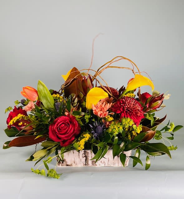 Rustic Floral Rustic Floral - Different colored floral that are the perfect complement to a rustic container. Adding some willow accents for texture and artistic flair.