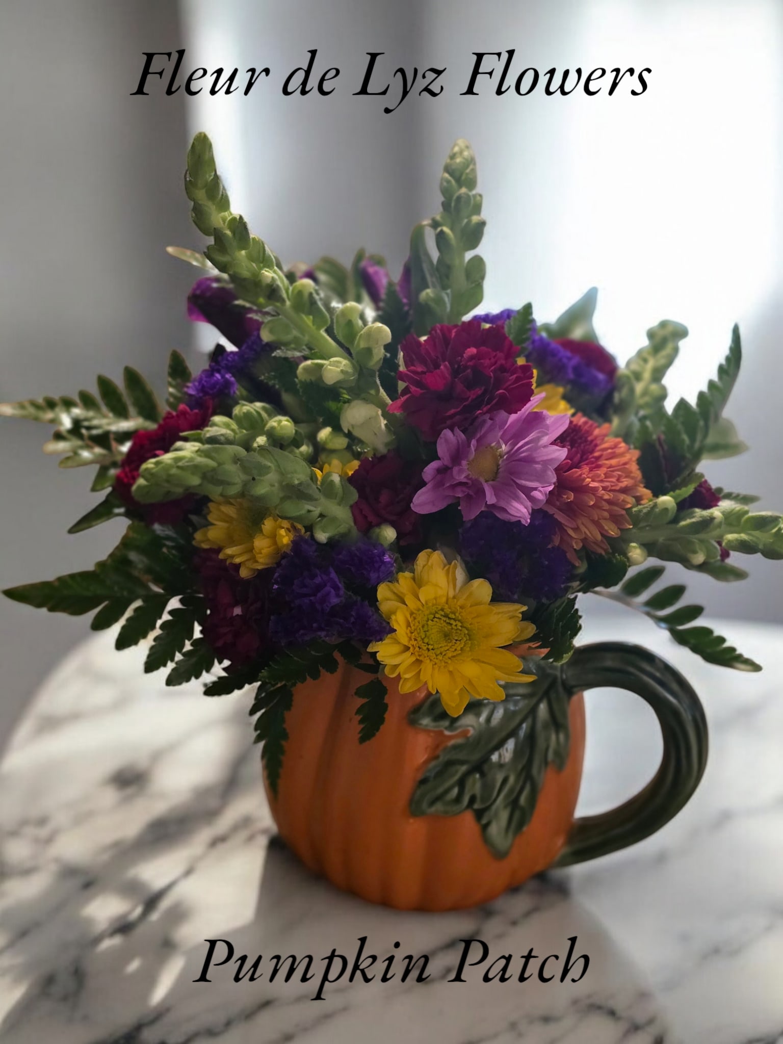 Pumpkin Patch Pumpkin Patch - A beautiful Fall arrangement designed in a pumpkin mug which includes red Carnations, red and yellow Daisies and white snap dragons