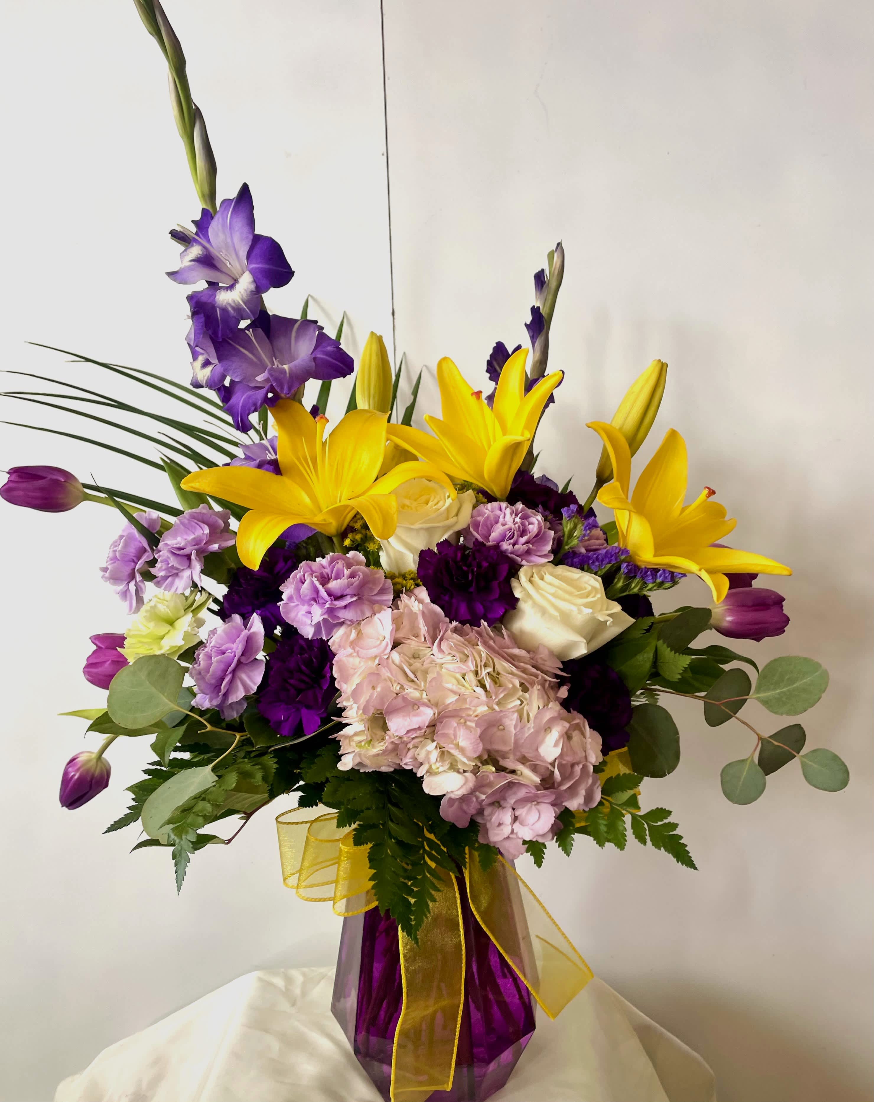 Spring Fever! Spring Fever! - Spectacular big, beautiful and colorful arrangement. Brighten someone's day with this happy and beautiful arrangement!