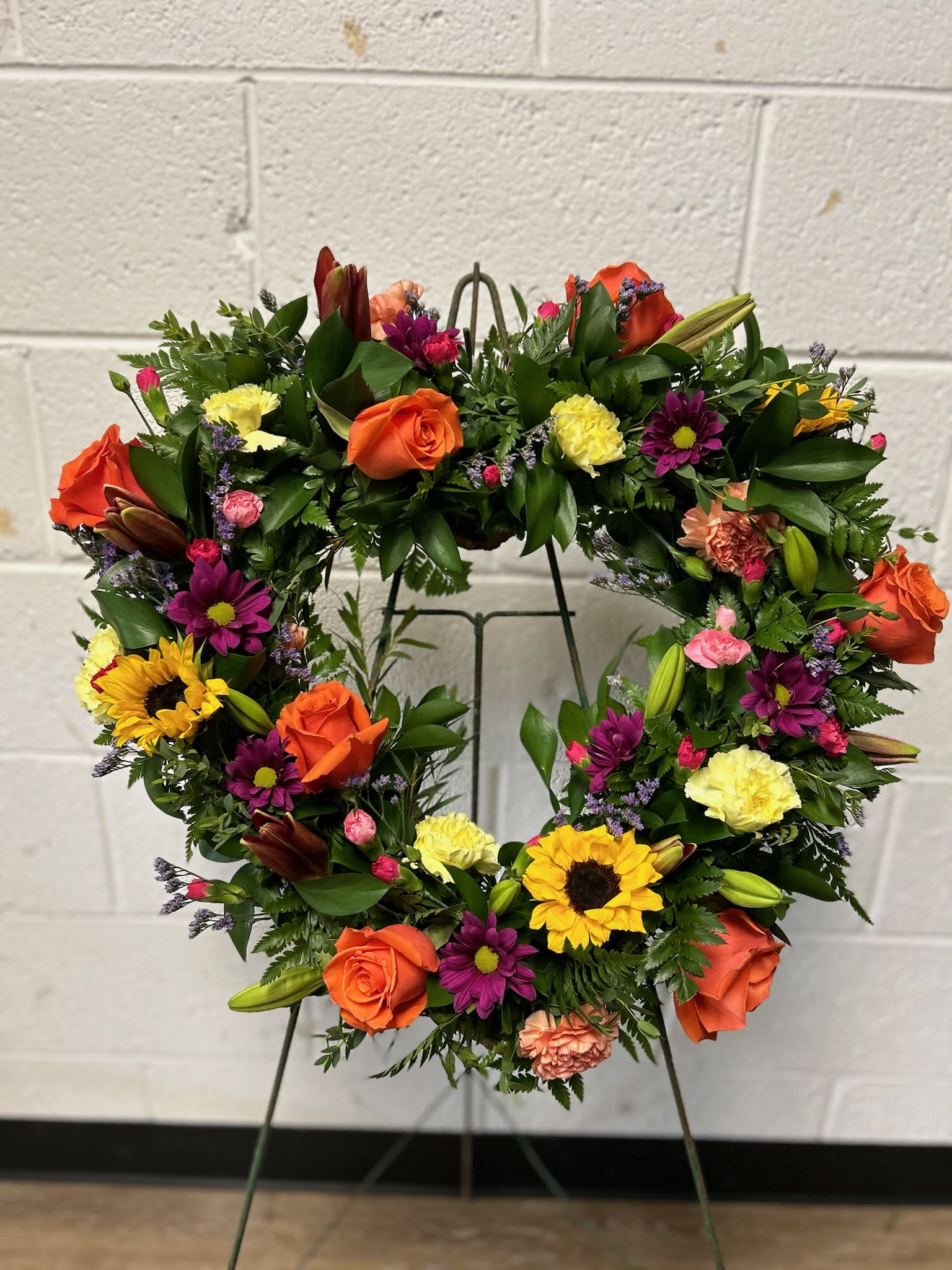 Spring Heart ( Standing Spray ) - Show your love with our Foam Heart Standing Spray, crafted with your choice of flowers for a personalized touch. A beautiful tribute that speaks from the heart.