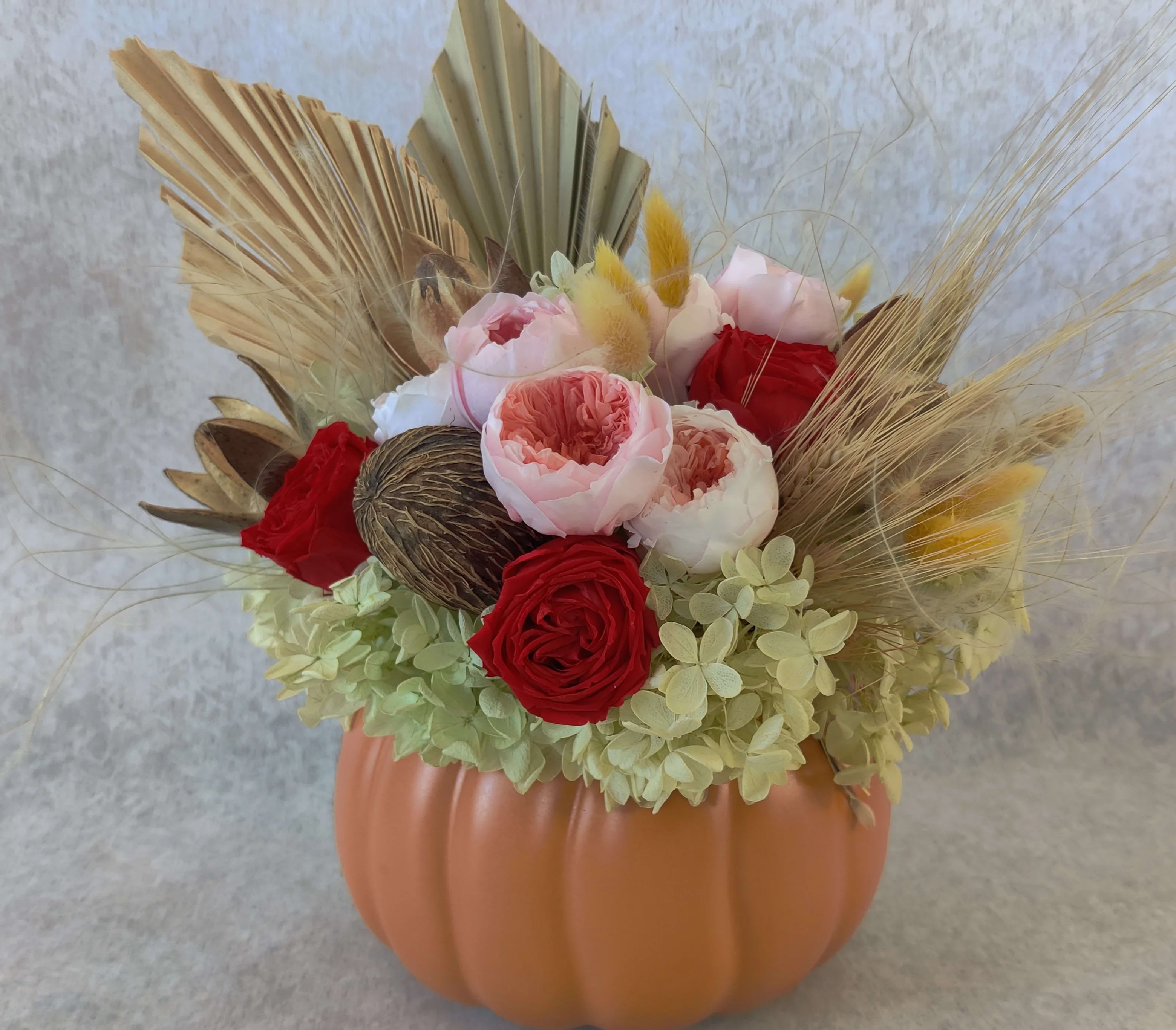 Perfect Pumpkin  - Ceramic pumpkin beautifully arranged with all preserved accents, hydrangeas and garden roses. A perfect long lasting gift for the season. 
