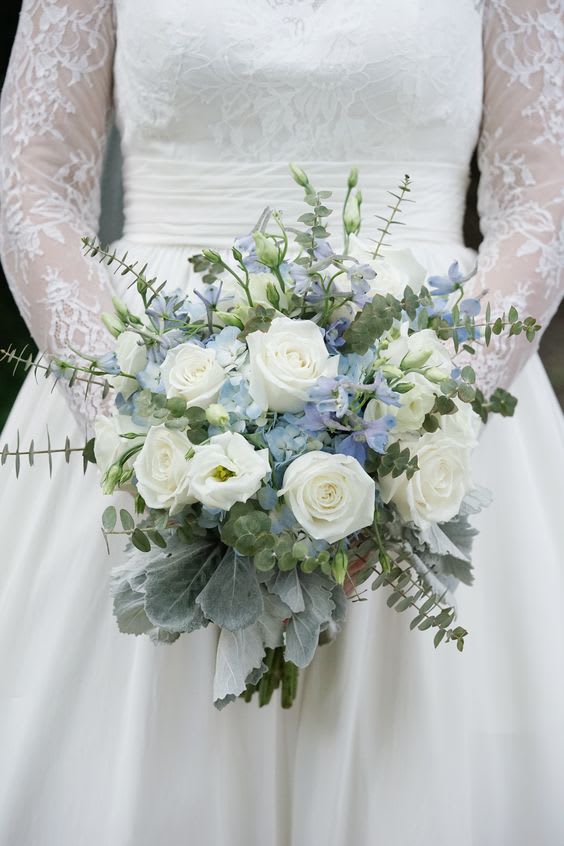 WB-2196 WB-2196 - Round bridal bouquet of light blue delphinium, white roses, hydrangeas, lisianthus, eucalyptus, dusty miller