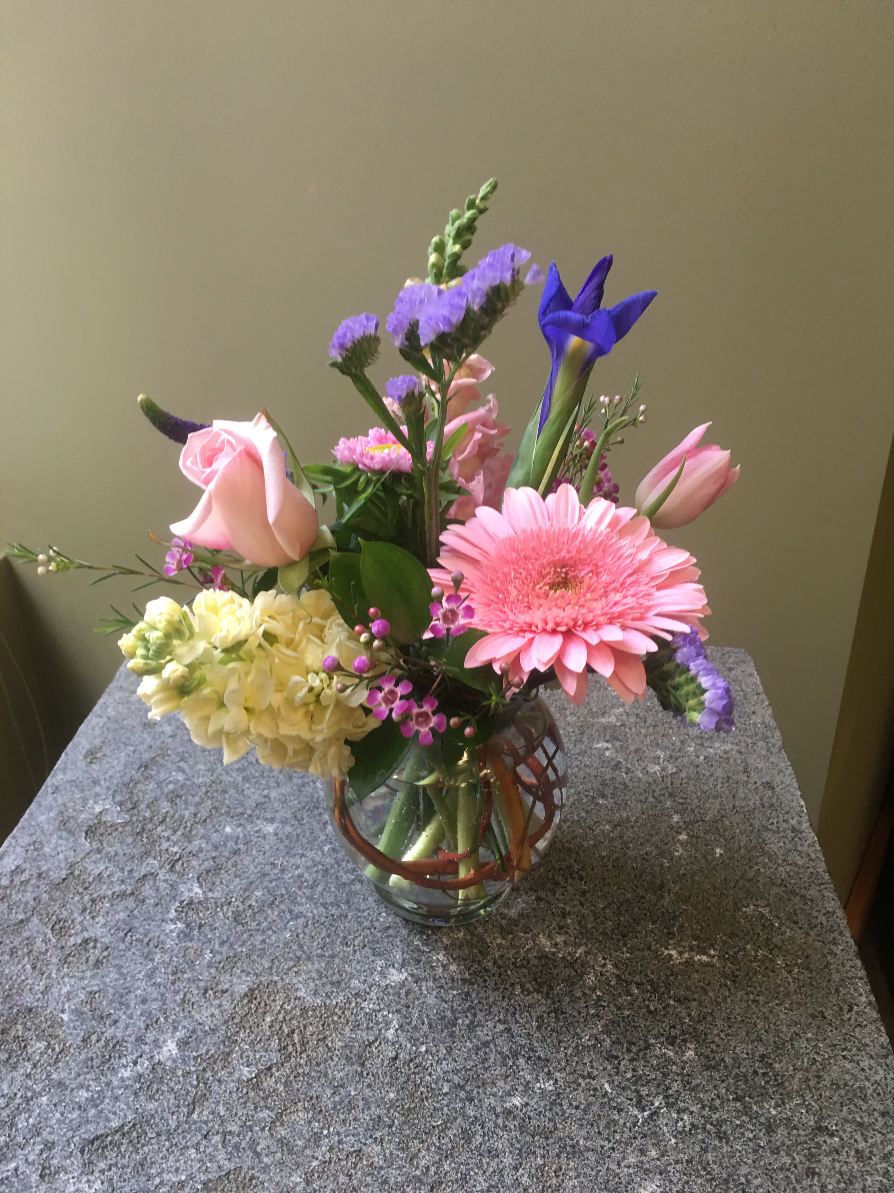 Spring in Bloom - One of a kind creation - Designers choice arrangement of seasonal pastel flowers. Flowers will vary by what's available and in stock  ARRANGEMENT WILL NOT LOOK LIKE PICTURE