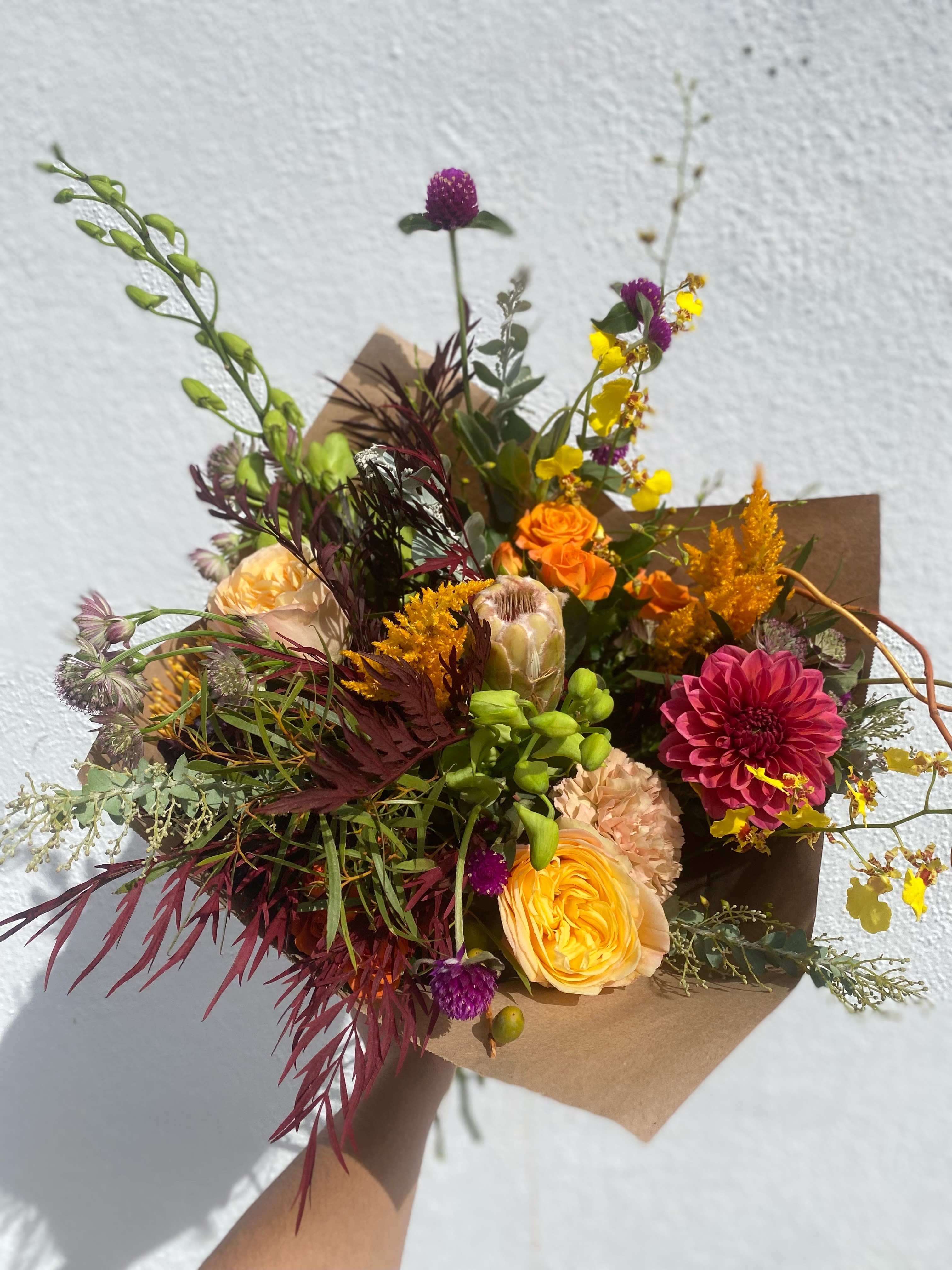Wild Fall Wild Fall - This gorgeous wild bouquet includes a variety of fall and in season flowers for the holidays.