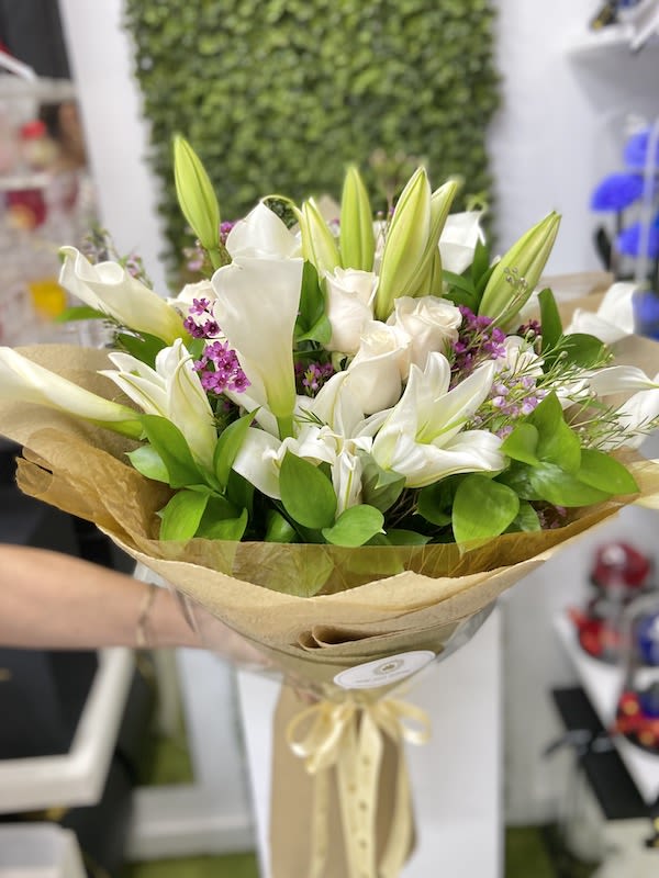 Calla Blanc Rose Bouquet - White  - Blanc Rose Bouquet: Callas with some roses and lilies Euro wrapped in a our deluxe floral paper decorated with a ribbon. (NO VASE INCLUDED)