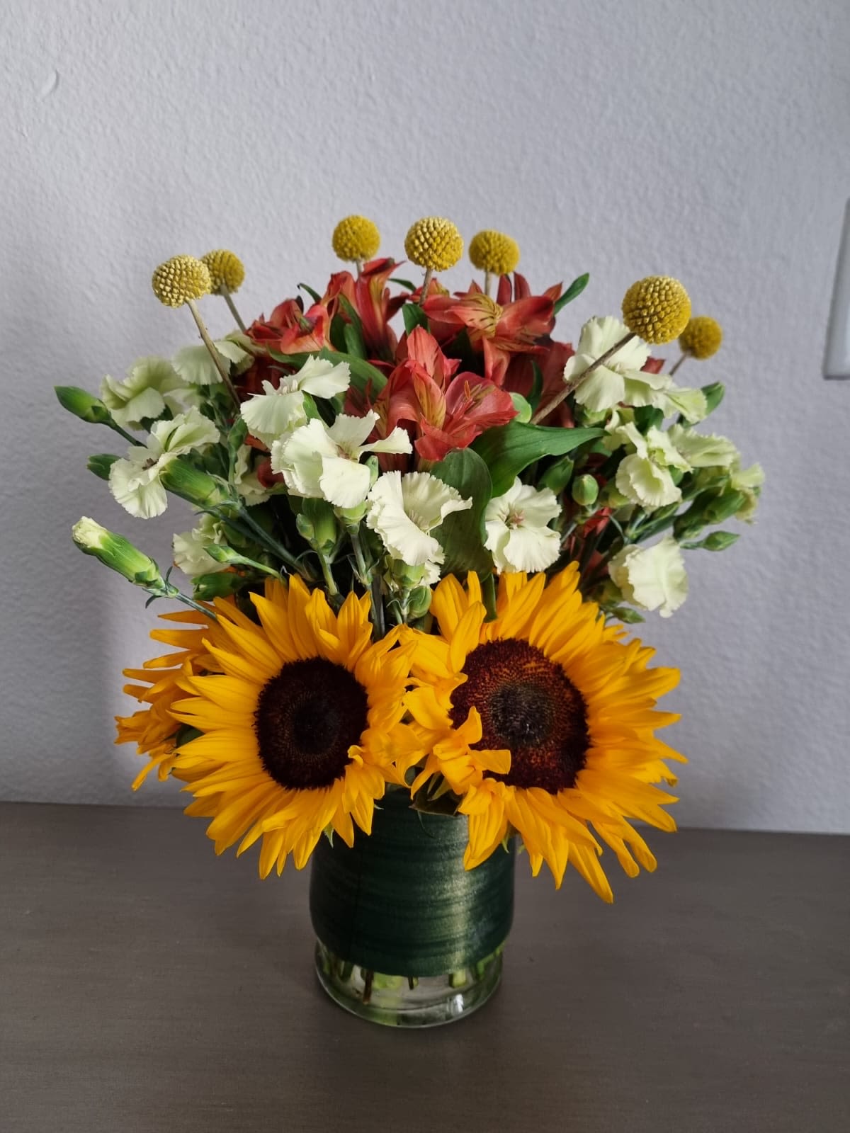 Sunfire bloom - This sunflower bouquet radiates warmth and joy, with each golden bloom embodying the spirit of sunshine and positivity.