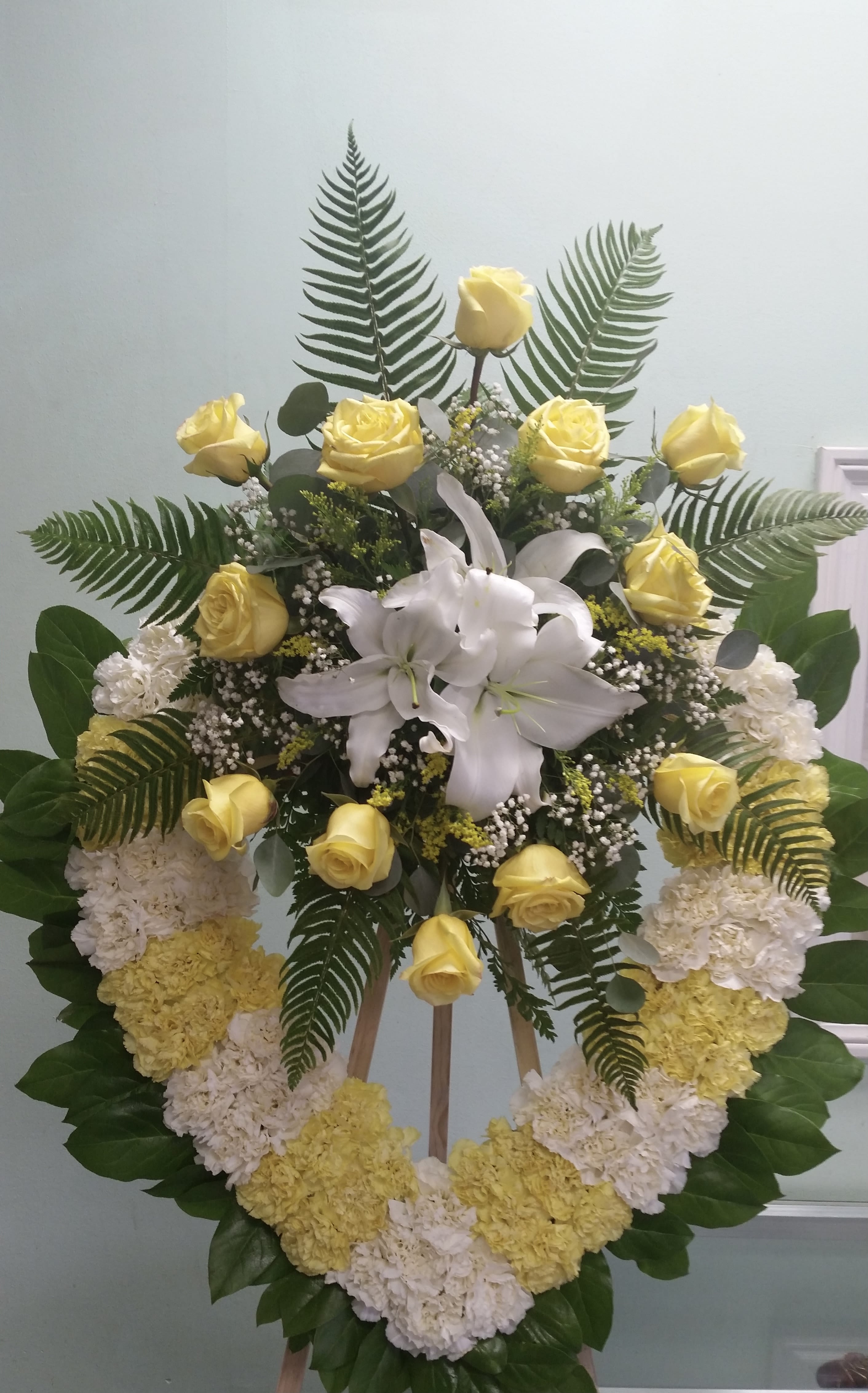 Joyful Sunrise Heart Joyful Sunrise Heart - Open heart with white and yellow carnations, yellow roses, and white lilies.