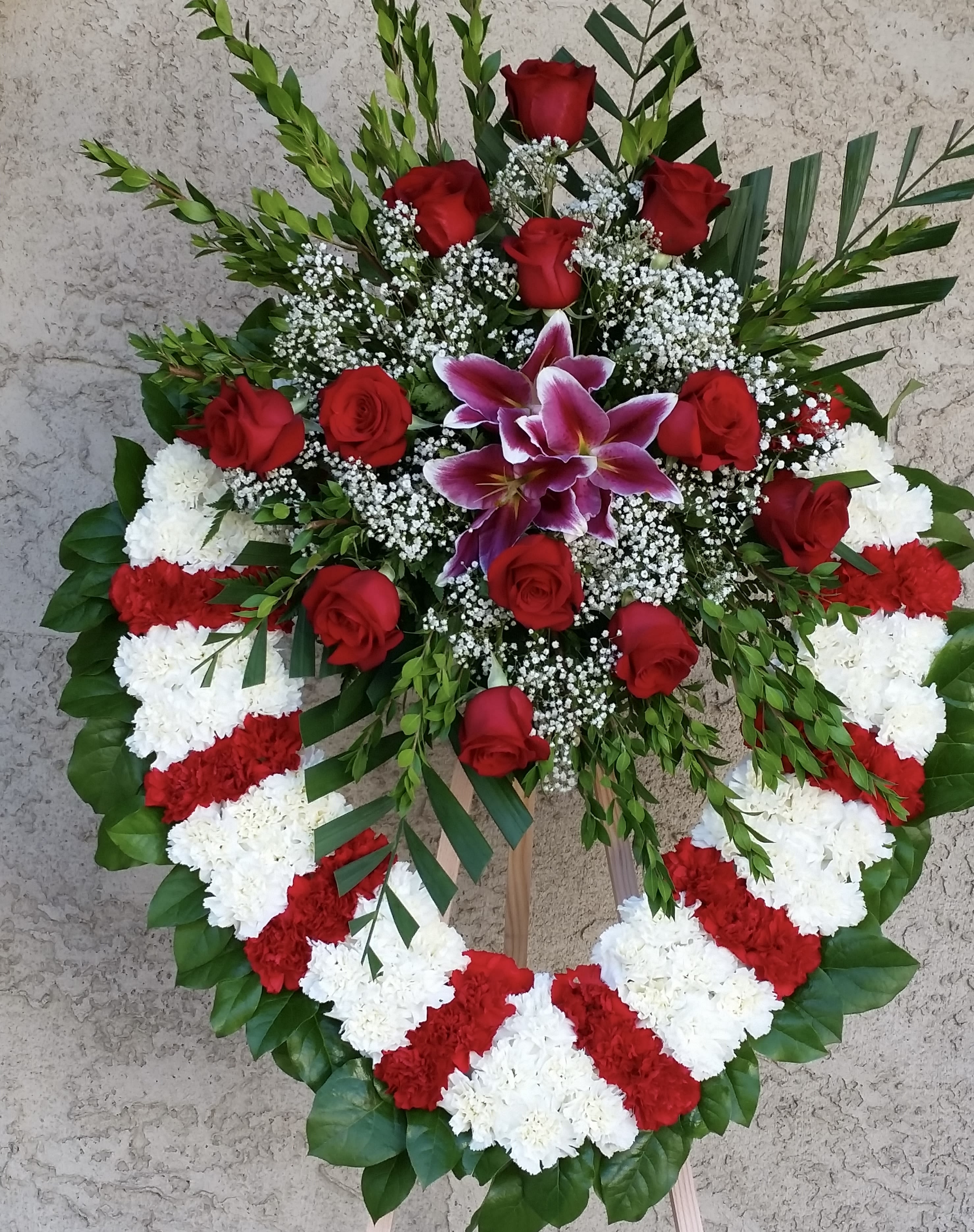 Farewell Tribute Heart Farewell Tribute Heart - Open heart with white and red carnations, red roses, and pink lilies.
