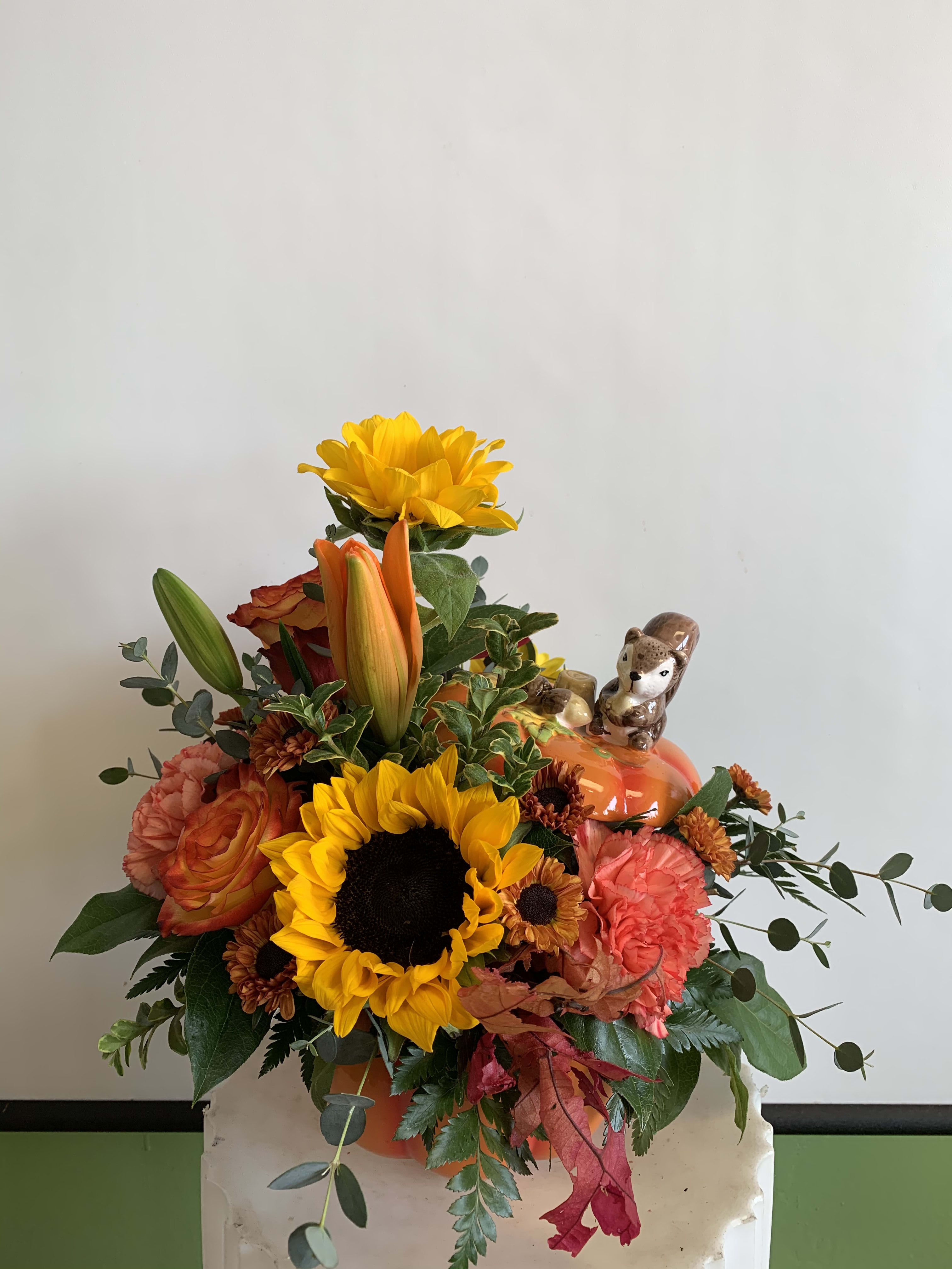 Cute Pumpkin - Autumn Flowers in a ceramic orange pumpkin... A very cute squirrel stands on the top of the lid... very adorable!!!
