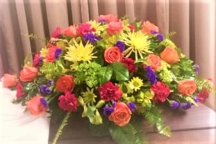 Bright and Lush - Half Casket Spray of roses, hydrangeas,Fuji mums and more. Other colors available $195