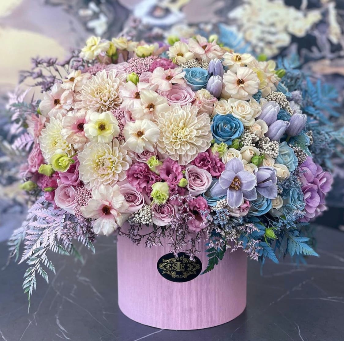 Boy or Girl? Boy or Girl? - Celebrate the exciting news with our Gender Reveal Flower Box! This playful arrangement features a stunning mix of blooms in either pink or blue, nestled among lush greenery. Perfect for sharing the big reveal, this delightful box adds a pop of color and joy to your celebration. Each arrangement comes in a charming, reusable container that makes for a lovely keepsake. Whether you’re throwing a party or surprising loved ones, our Gender Reveal Flower Box is a beautiful way to unveil your bundle of joy. Order yours today and let the celebration begin!